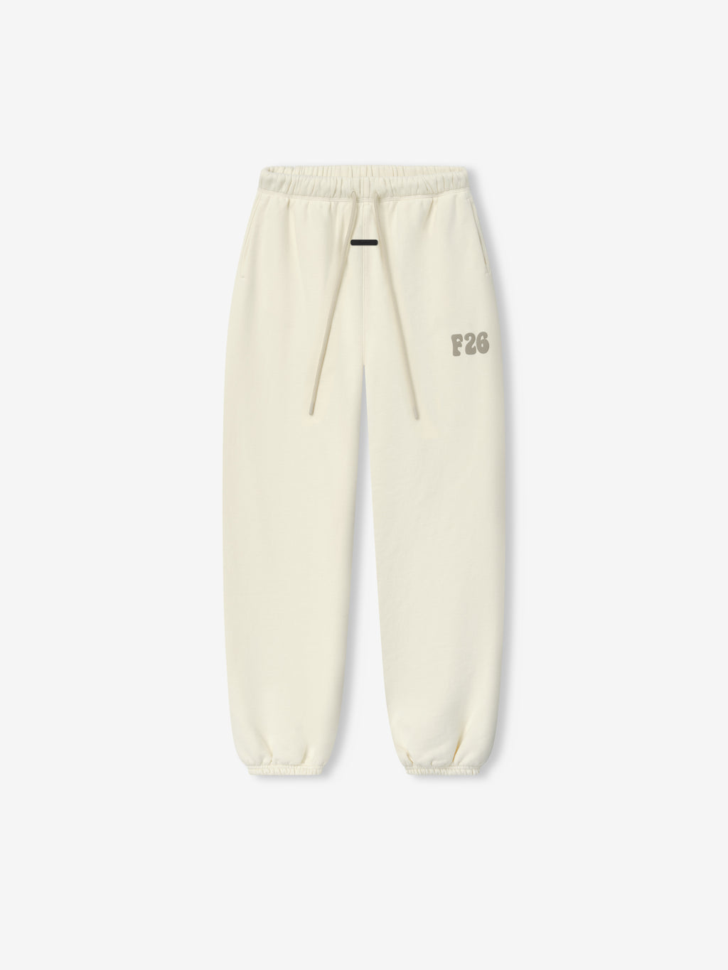 Womens Classic Fleece Sweatpant in a soft washed ivory tone with an elastic waistband, matching drawstrings, elastic cuffs, and a subtle F26 logo on the thigh for cozy casual bottoms.
