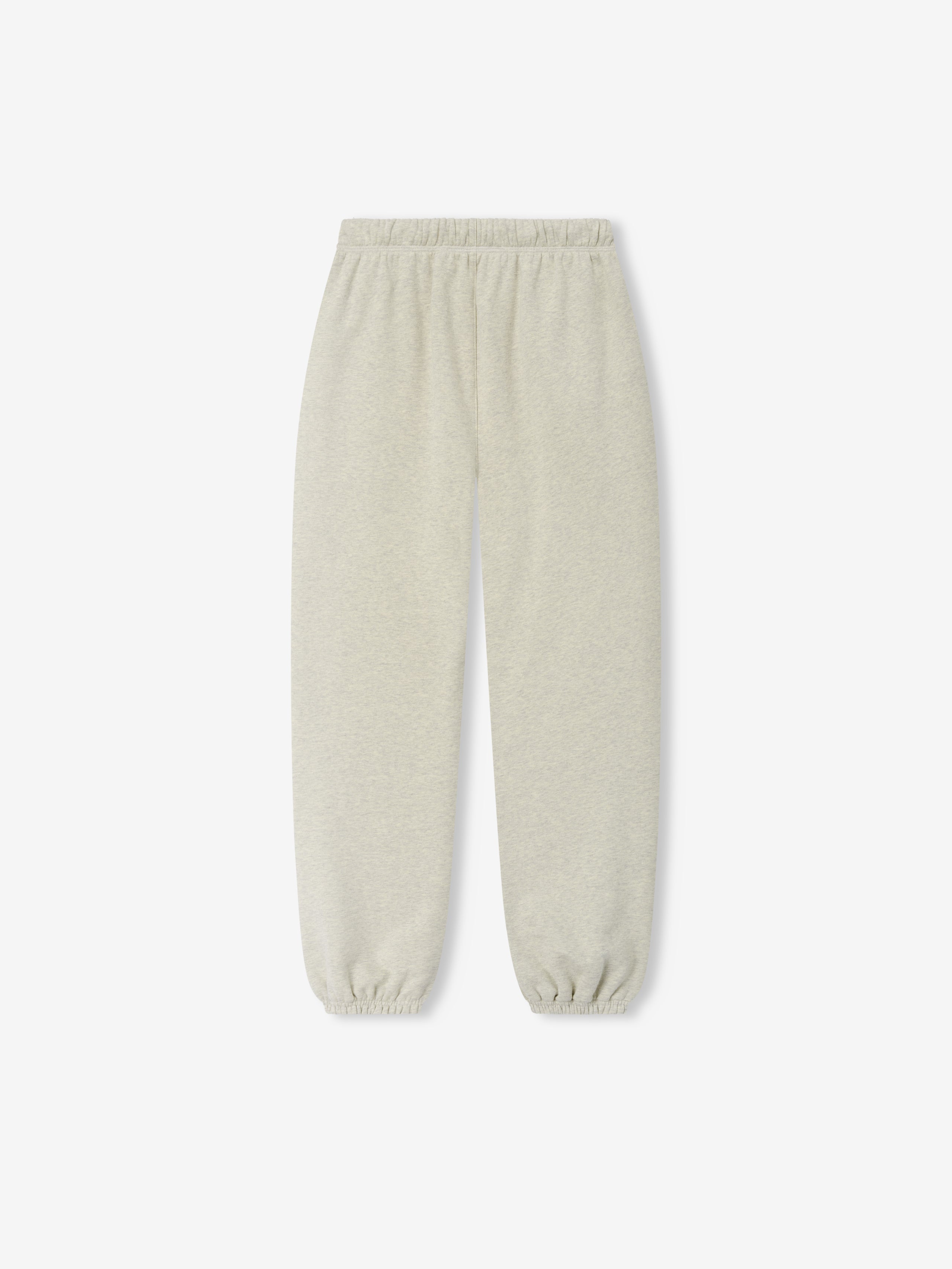 Womens Classic Fleece Sweatpant in a soft light vanilla heather shade with an elastic waistband and cuffs, offering a cozy and minimalist design for casual bottoms.