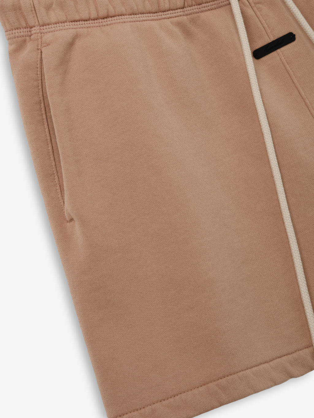 Classic Sweatshort in a muted ginger shade, crafted from soft fabric with an elastic waistband and side pockets, designed for comfortable casual bottoms.