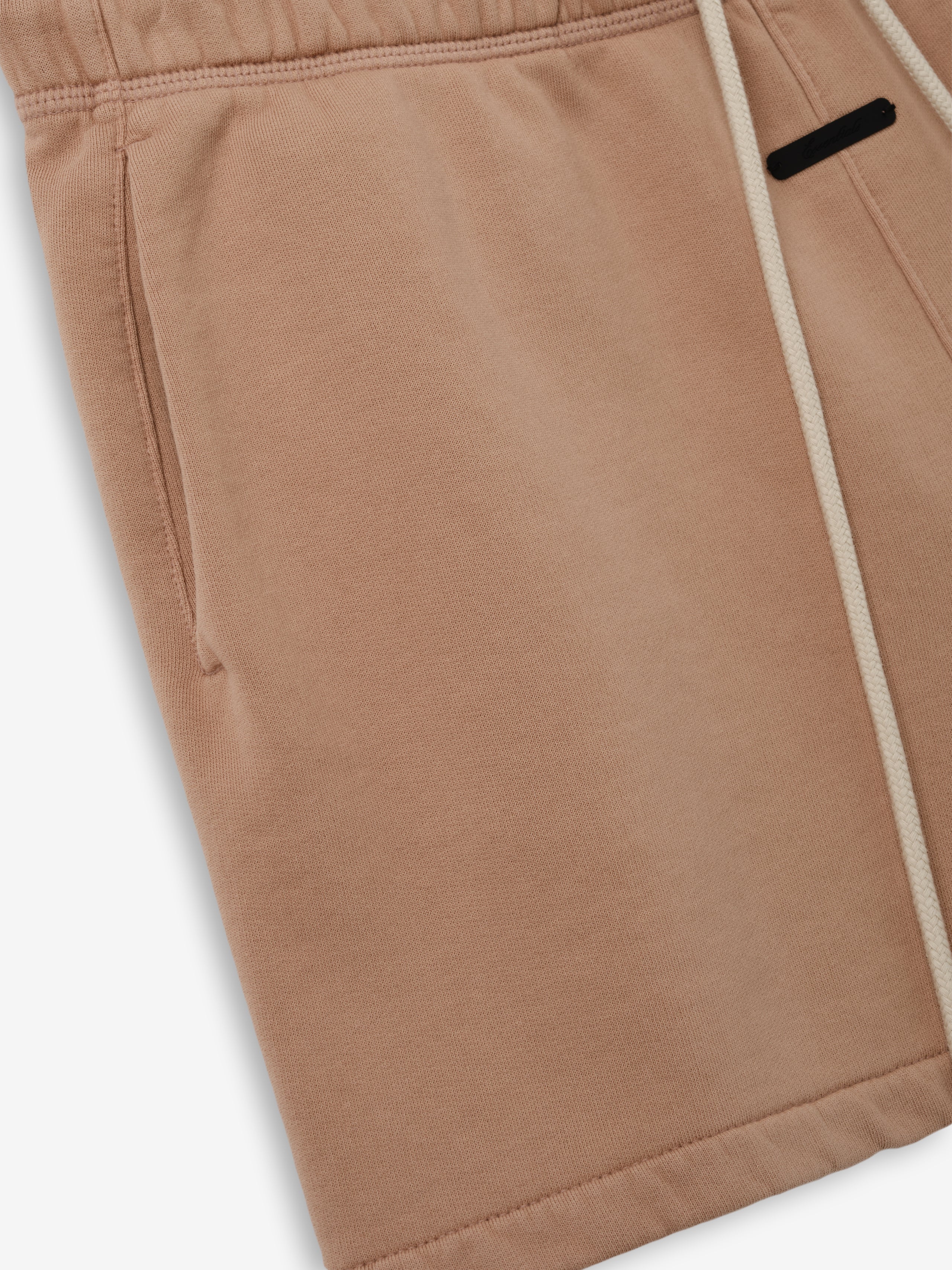 Classic Sweatshort in a muted ginger shade, crafted from soft fabric with an elastic waistband and side pockets, designed for comfortable casual bottoms.