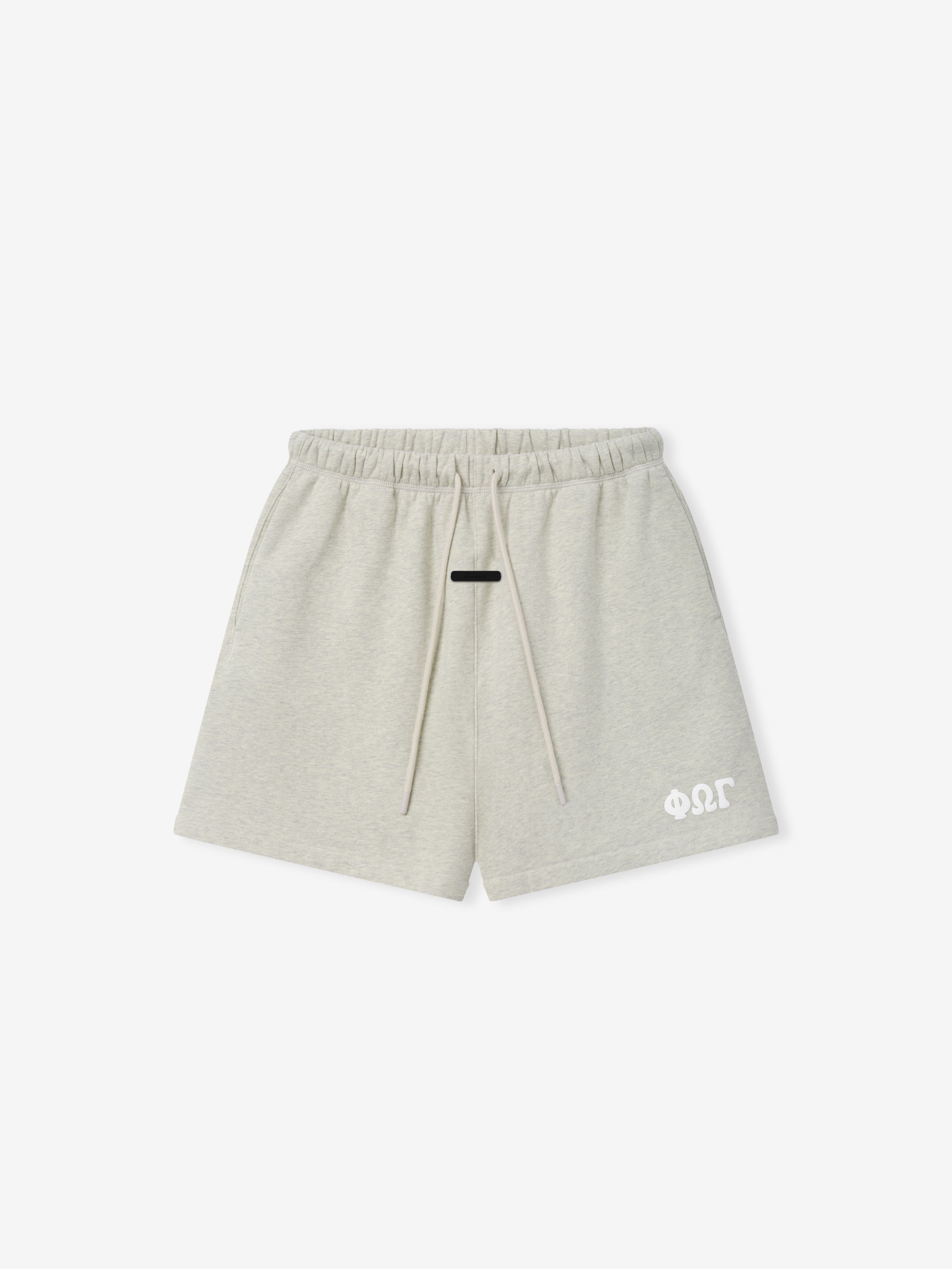 Classic Sweatshort in a soft washed vanilla heather shade, designed with an elastic waistband, long drawstrings, side pockets, and a small white logo on the lower left leg for casual bottoms.