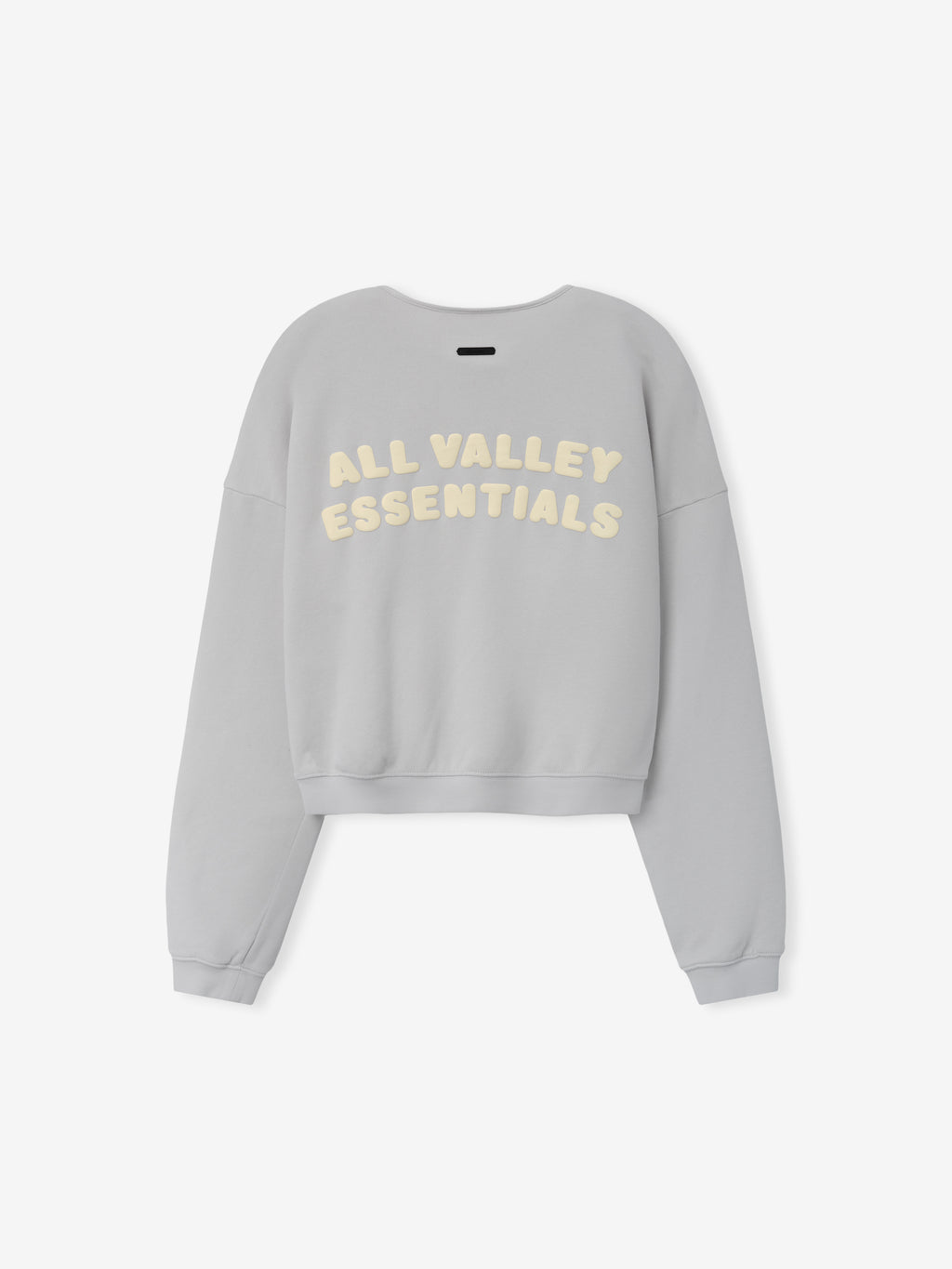Womens French Terry Relaxed Half Zip in a soft washed grey shade, shown from the back with cream-colored "All Valley Essentials" lettering on a relaxed, comfortable casual top.