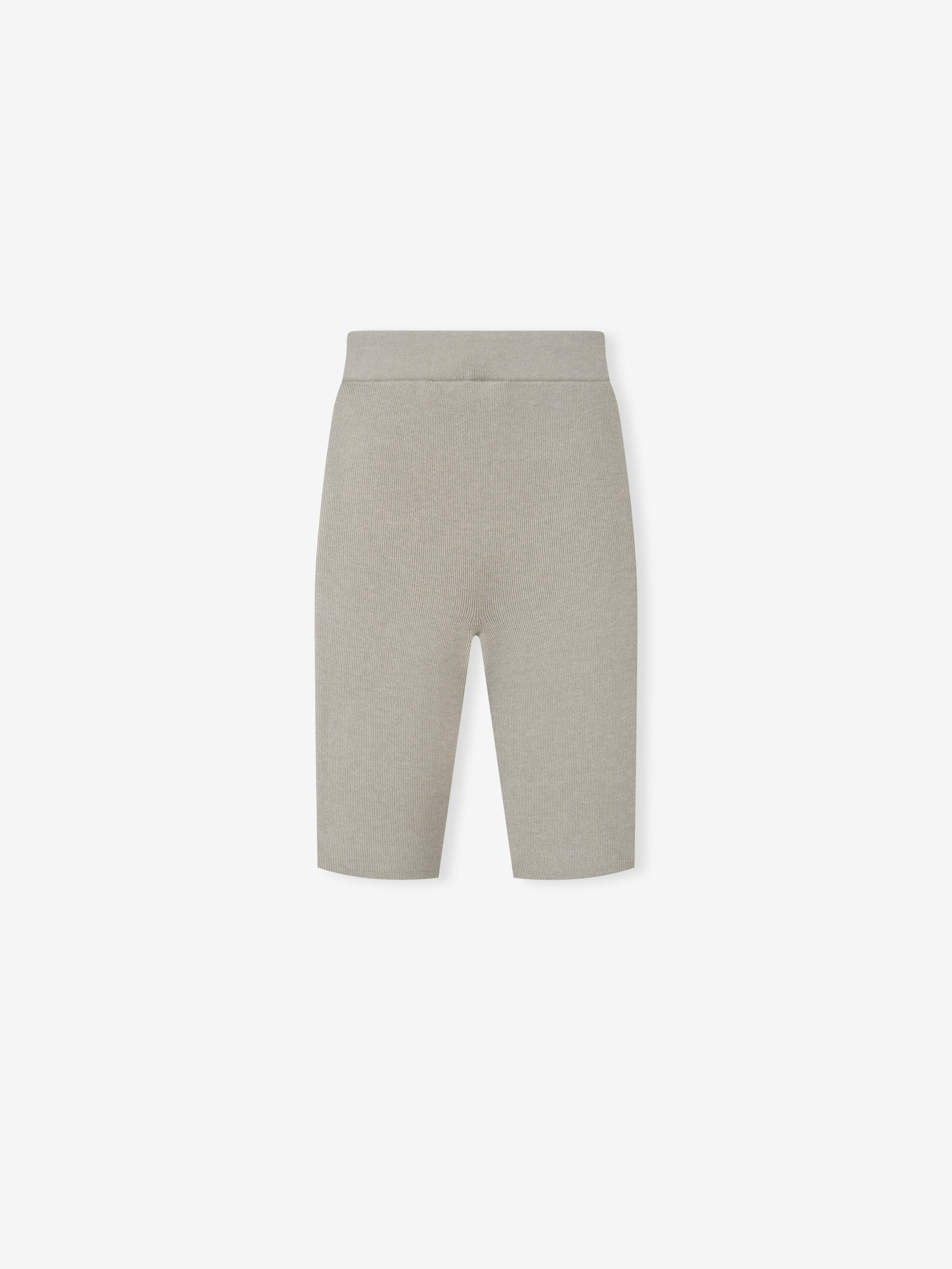 Womens Rib Knit Biker Short in a muted neutral tone, crafted from soft ribbed fabric with a high-rise waistband and mid-thigh length for a streamlined, casual fit.