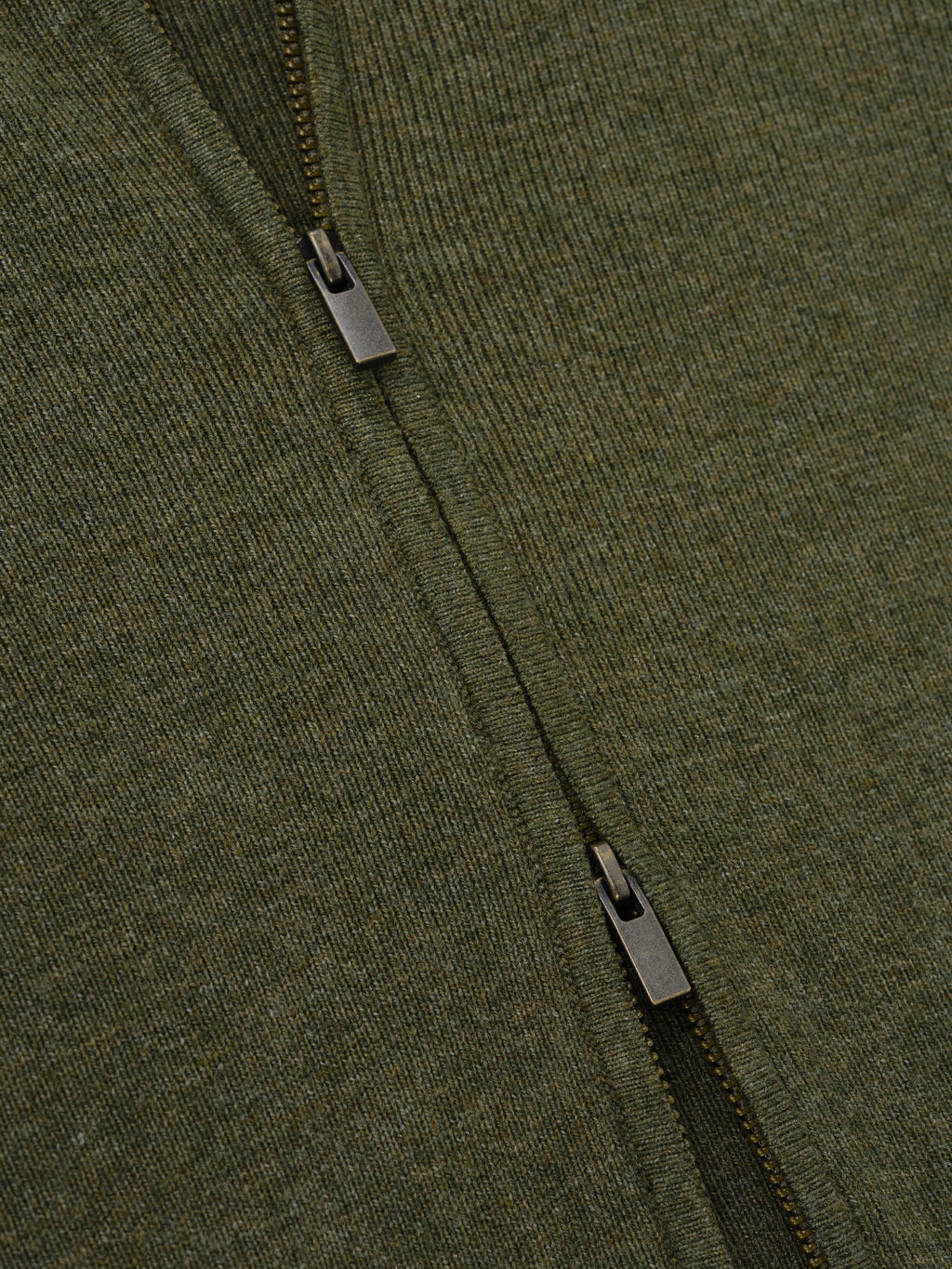 Womens Rib Knit Zip Up Jacket in a deep moss green, featuring a finely woven rib knit fabric and durable metal zipper details for a stylish outerwear option.