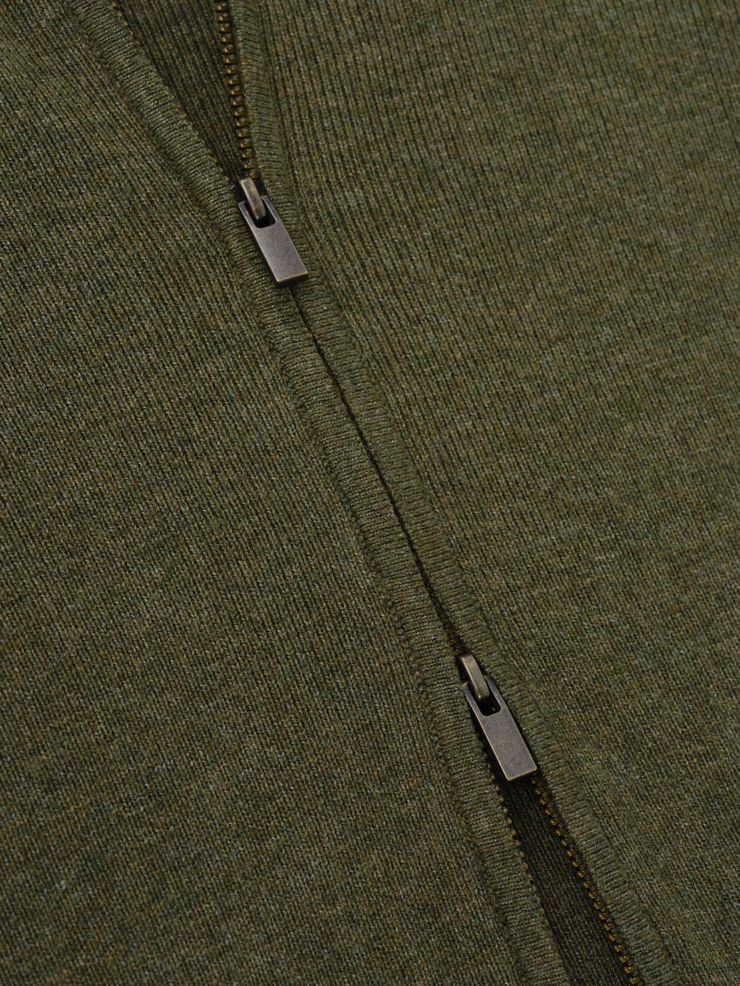 Womens Rib Knit Zip Up Jacket in a deep moss green, featuring a finely woven rib knit fabric and durable metal zipper details for a stylish outerwear option.