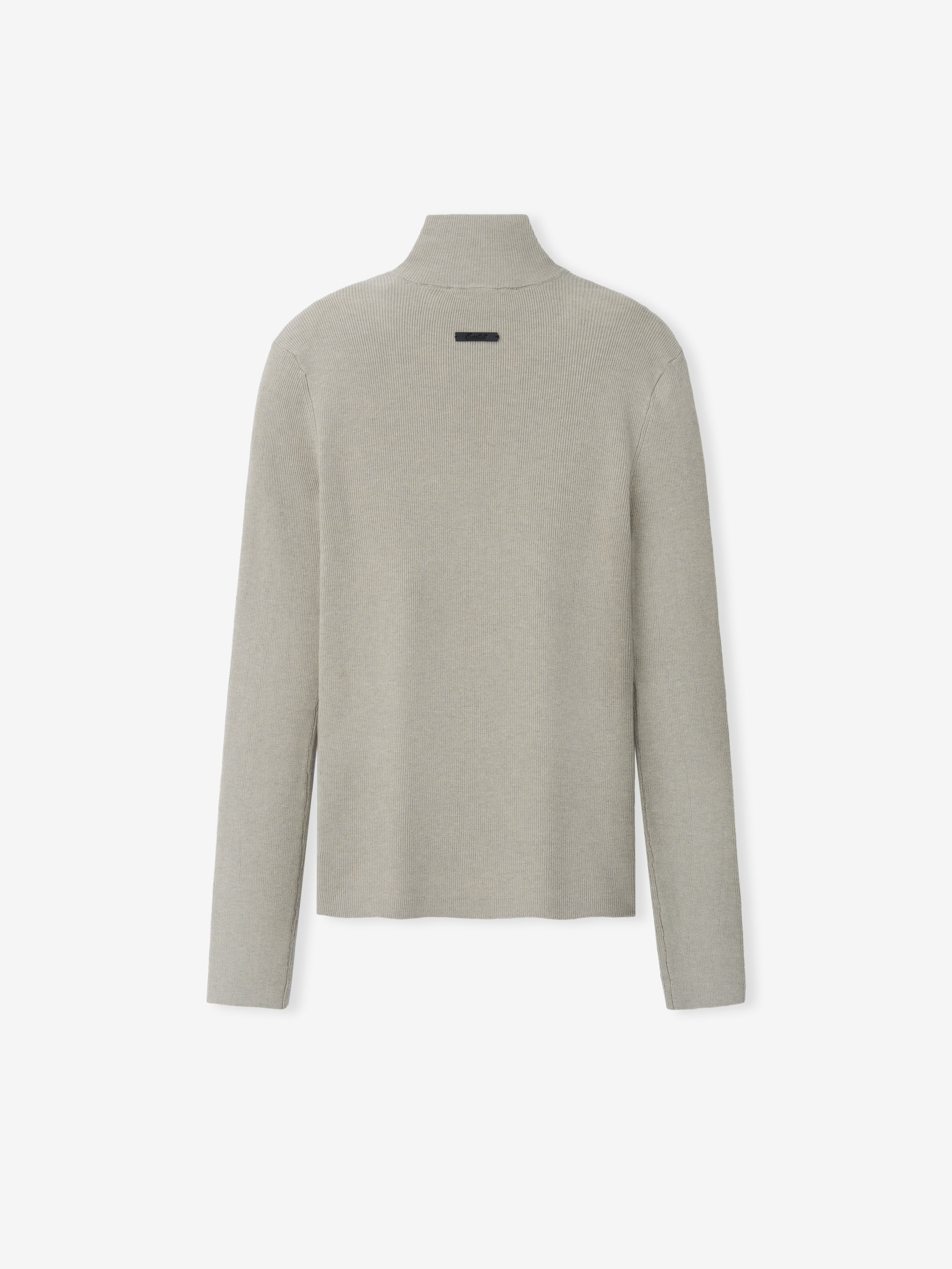 Womens Rib Knit Zip Up Jacket in a light neutral tone, featuring a smooth, finely knit texture with a high neck and long sleeves for a minimalist and refined outerwear staple.