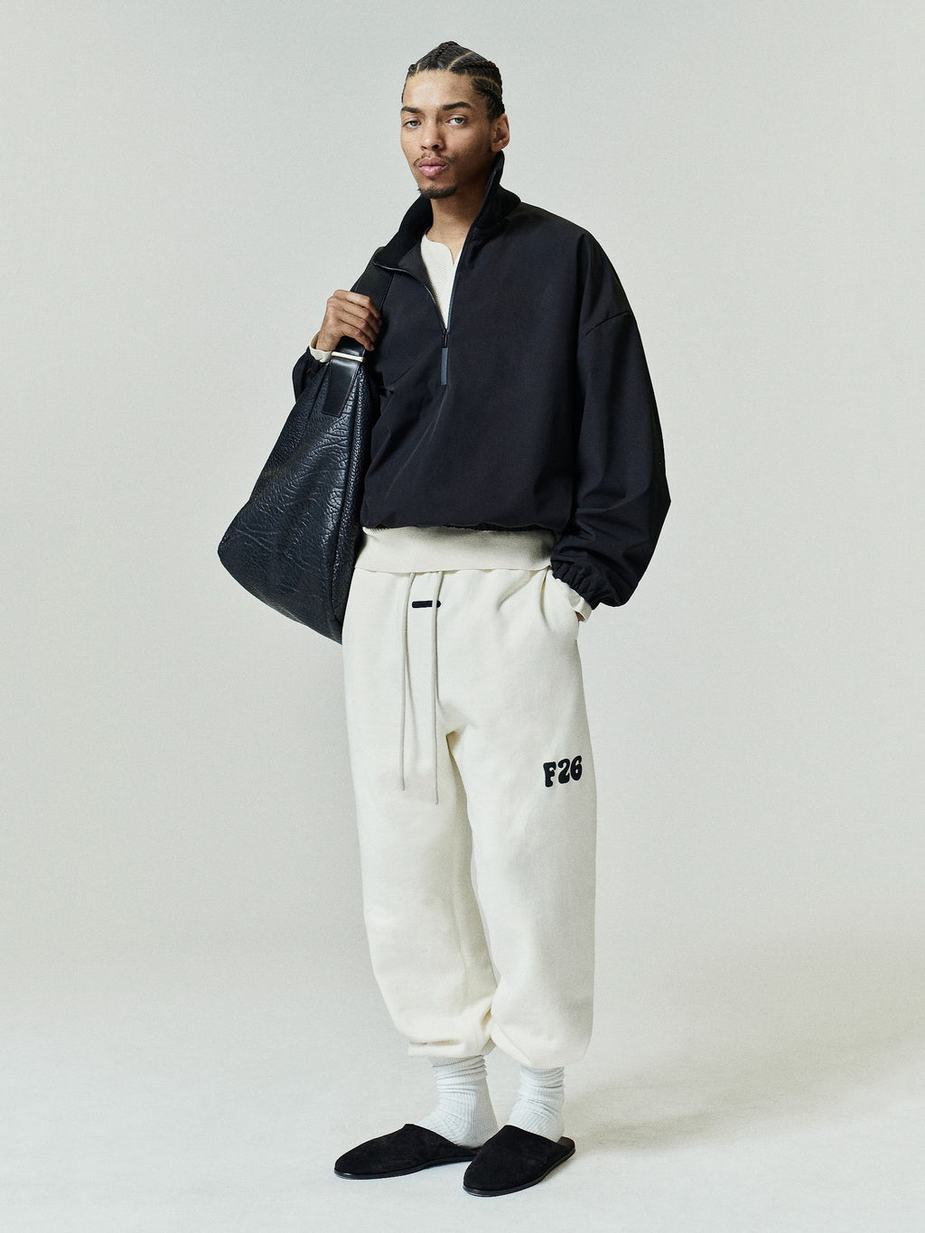 Classic Fleece Sweatpant in soft washed ivory, featuring an adjustable drawstring waist, elastic cuffs, side pockets, and a black F26 logo on the thigh for relaxed casual bottoms.