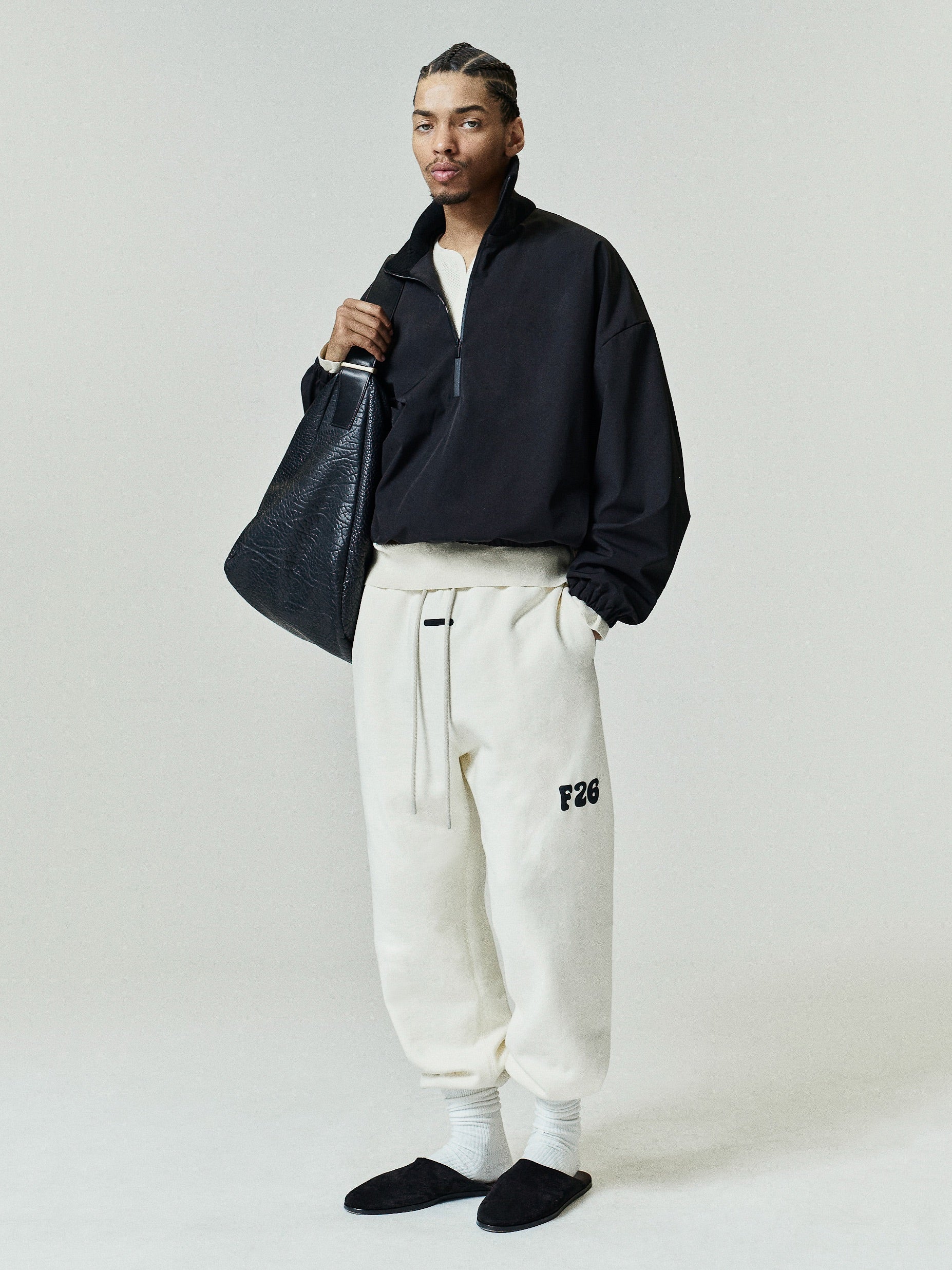 Classic Fleece Sweatpant in soft washed ivory, featuring an adjustable drawstring waist, elastic cuffs, side pockets, and a black F26 logo on the thigh for relaxed casual bottoms.