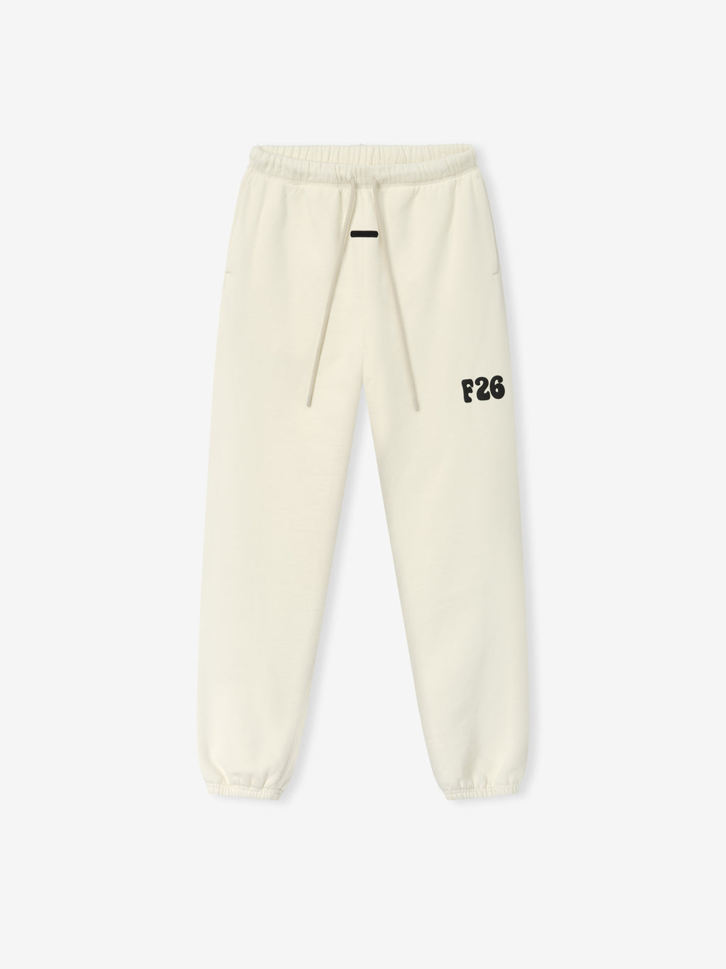 Classic Fleece Sweatpant in a soft ivory shade featuring an elastic waistband with drawstring, side pockets, elastic cuffs, and a bold black F26 logo on the left thigh for casual bottoms.
