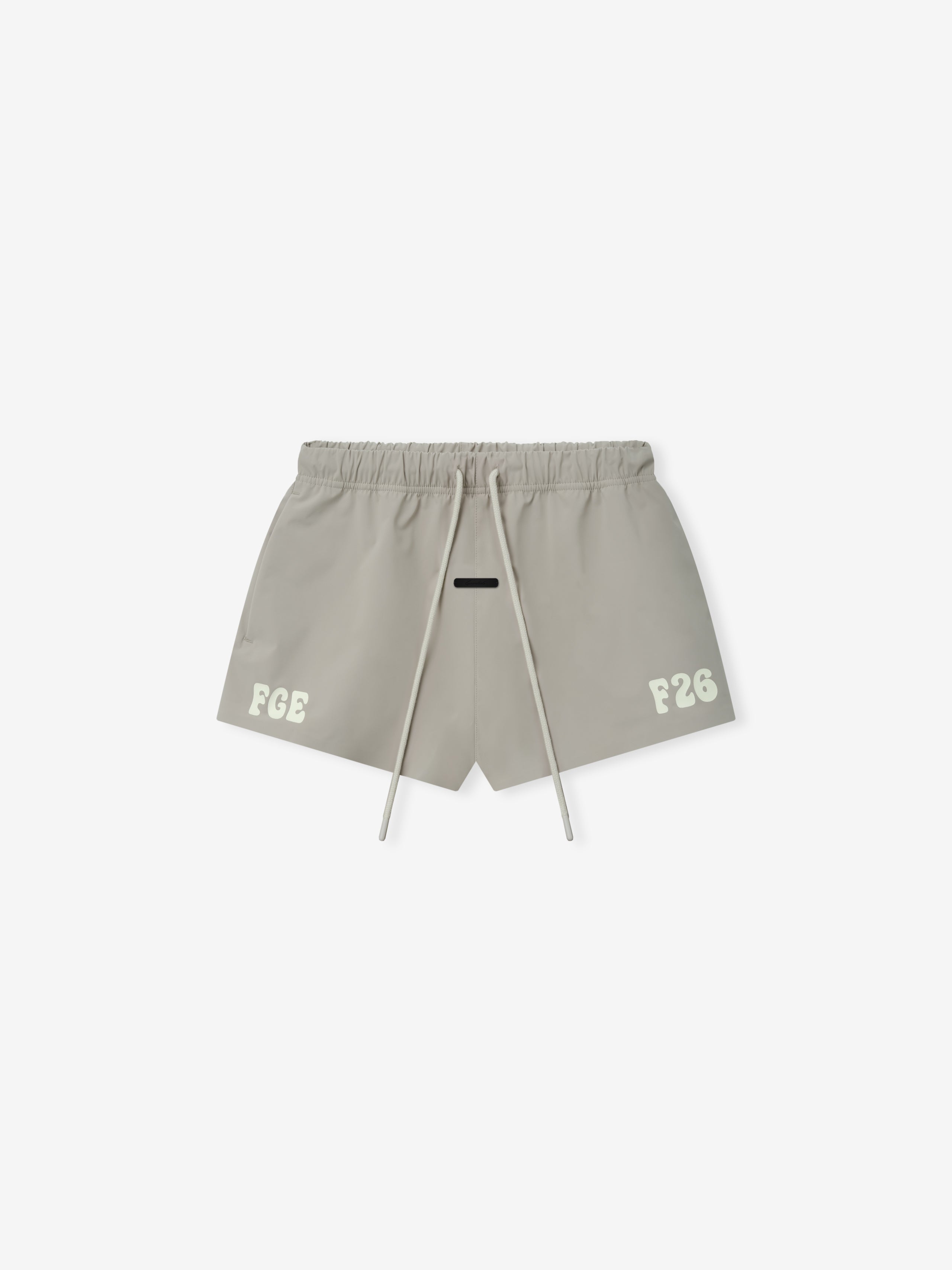 Running Short in a muted neutral tone, featuring a lightweight fabric with an elastic waistband, adjustable drawstrings, and bold printed details for sporty casual bottoms.