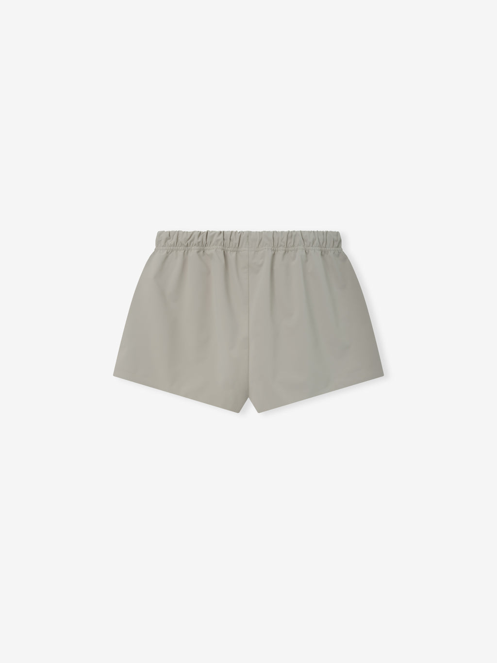 Running Short in a soft neutral tone, designed with a smooth fabric, featuring an elastic waistband for comfort and a relaxed fit ideal for casual or active wear.