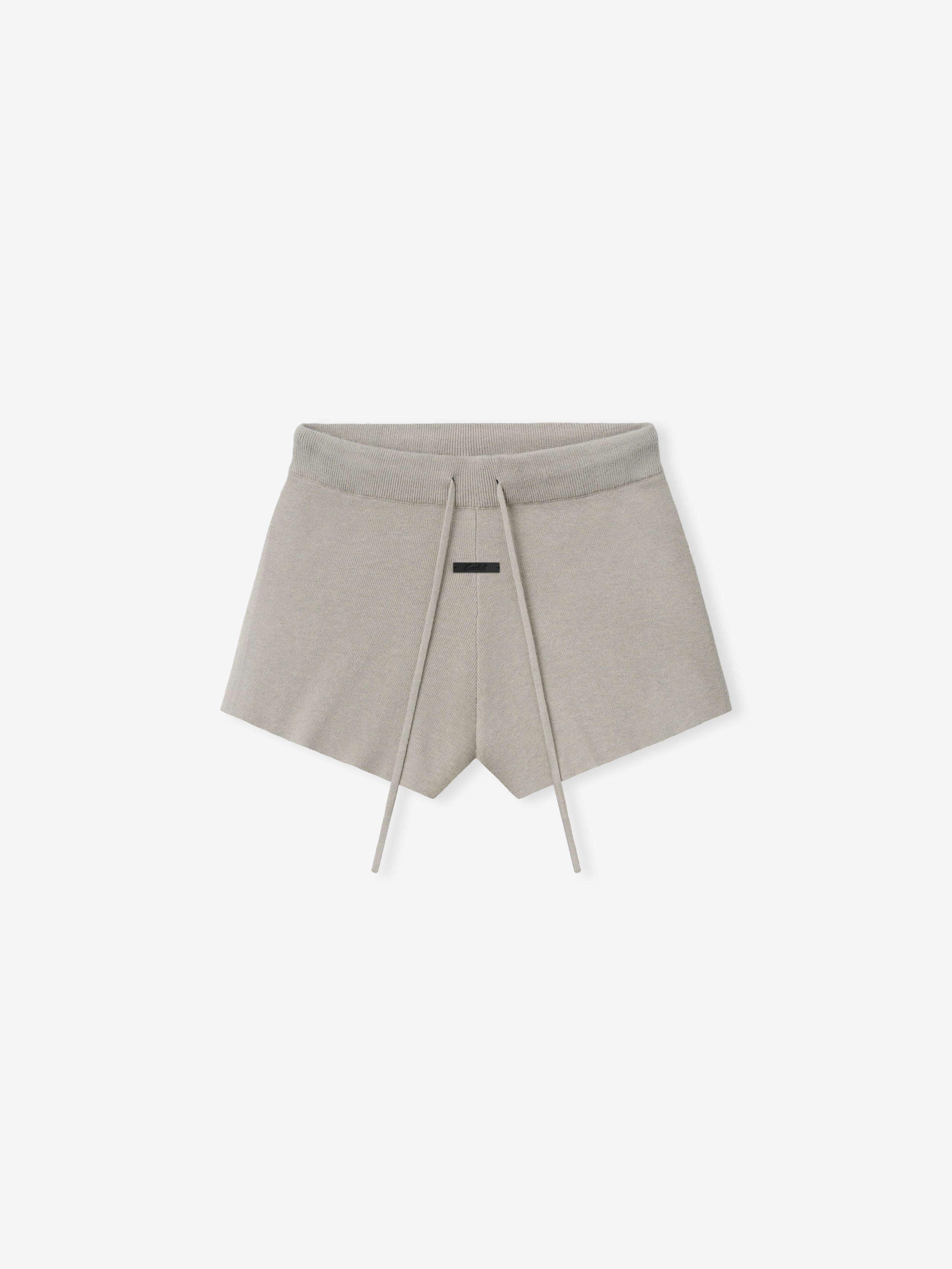 Womens Soft Knit Running Short in a light neutral shade, crafted from soft knit fabric with an adjustable drawstring waistband and a clean minimalist design for comfortable casual bottoms.