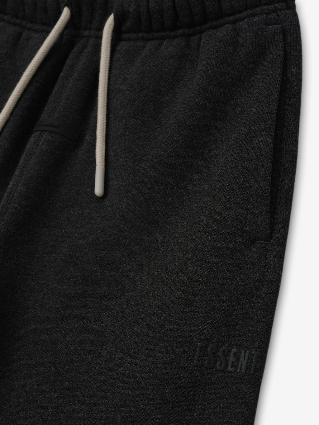 Kids Classic Fleece Sweatpant in a dark iron grey heather color, featuring a soft elastic waistband with contrasting drawstrings and discreet embossed branding on the side for kids bottoms.