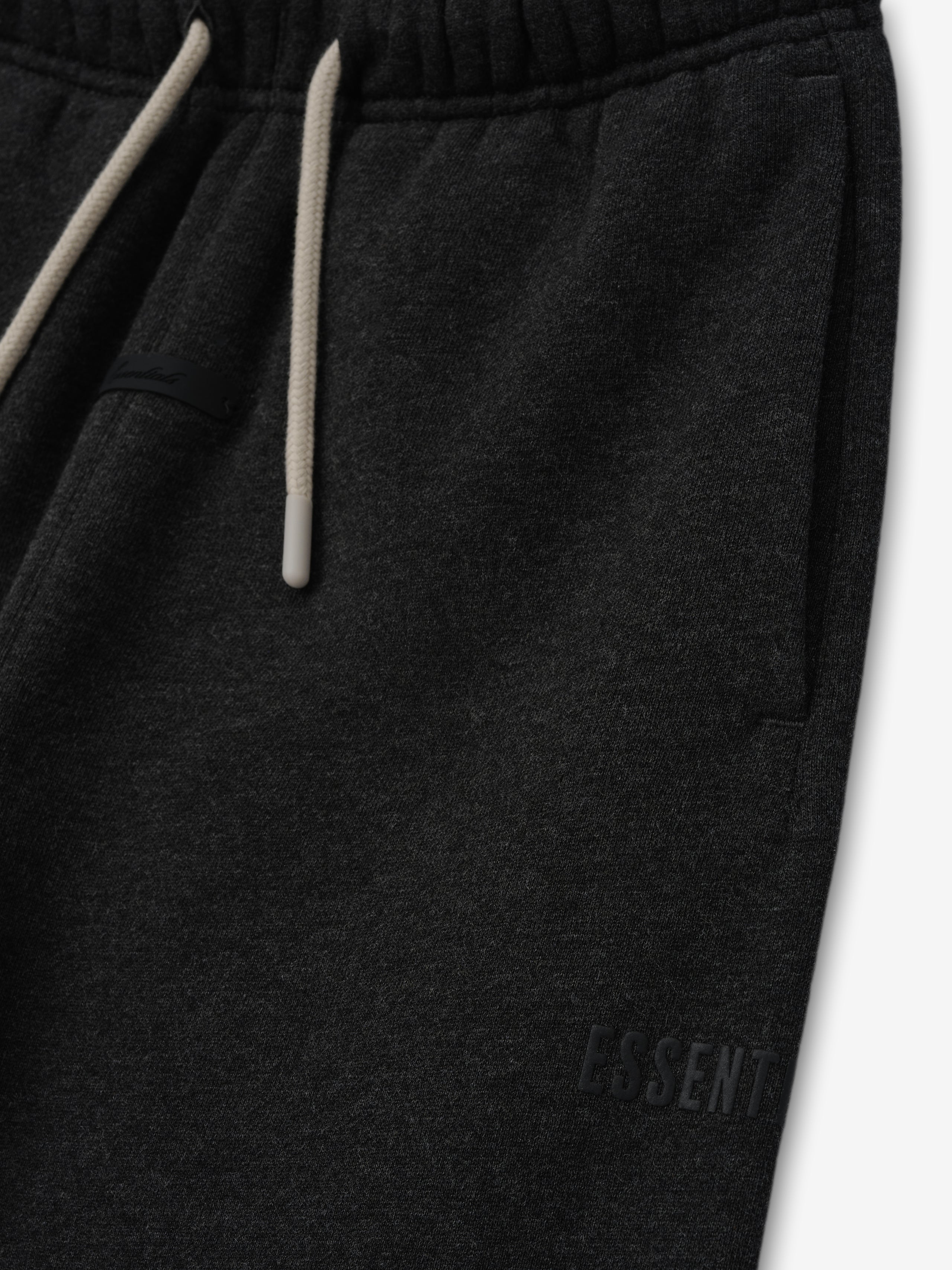 Kids Classic Fleece Sweatpant in a dark iron grey heather color, featuring a soft elastic waistband with contrasting drawstrings and discreet embossed branding on the side for kids bottoms.