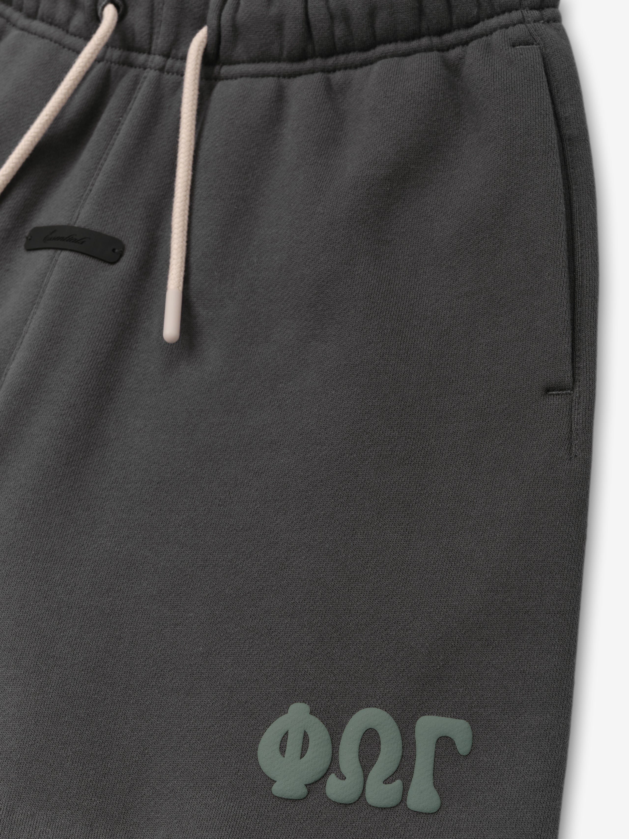 Kids Classic Sweatshort in a deep iron grey shade, featuring a comfortable elastic waistband with contrasting drawstrings and embossed branding detail for casual kids bottoms.