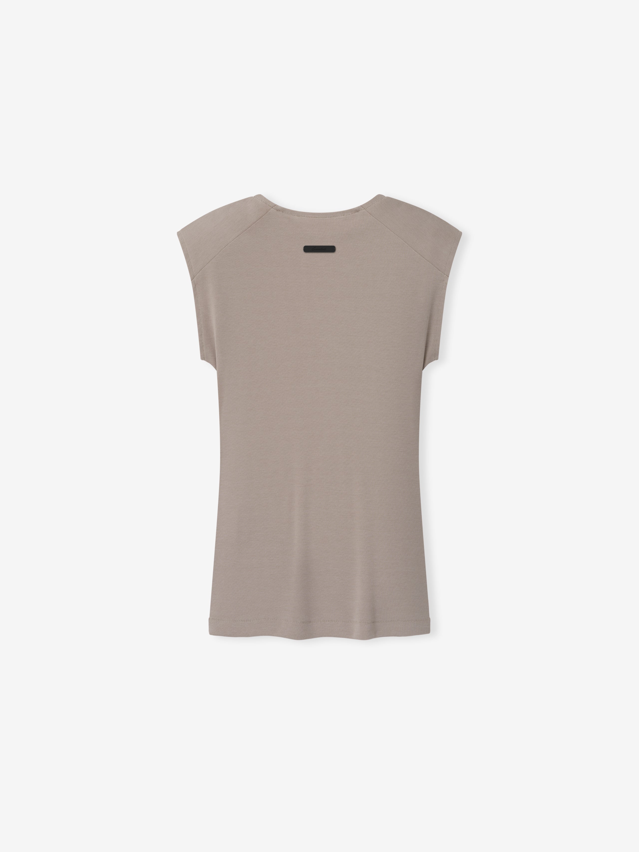Soft Rib Fitted Tank in a muted taupe color, featuring a smooth ribbed fabric with a minimalist back design and subtle shoulder seam details for a refined look.