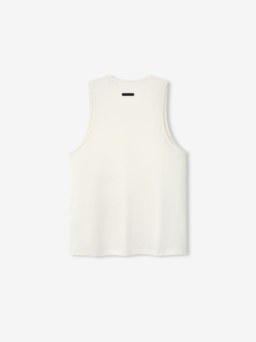 Womens Tri-Blend Classic Tank in a soft ivory tone, featuring a clean back design with a subtle contrasting tag detail for a minimalist, versatile casual top.