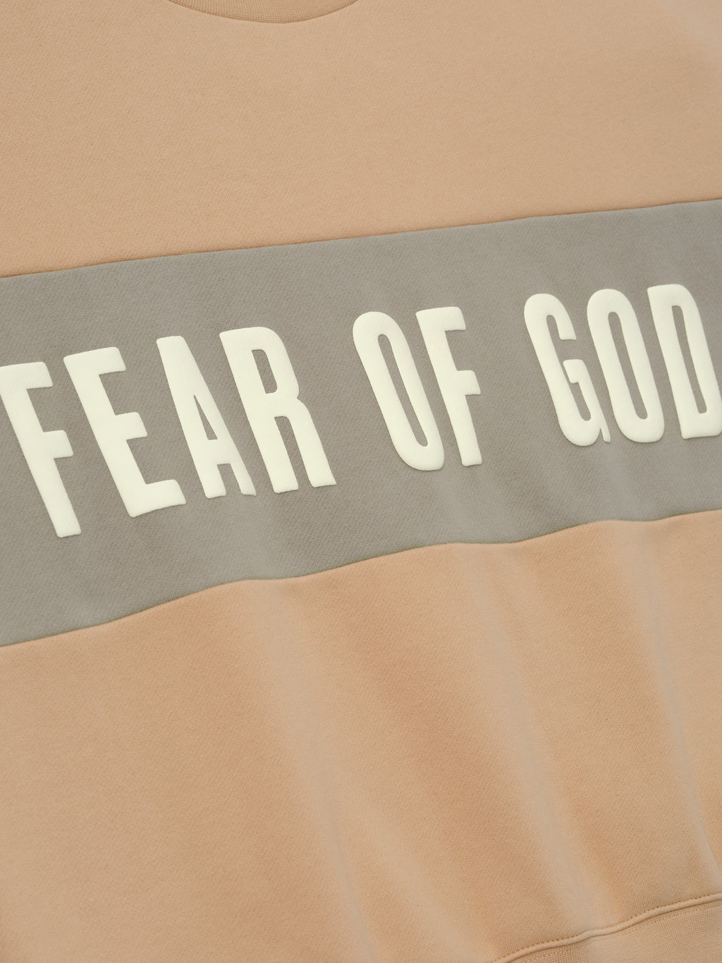 Womens Paneled Classic Sweatshirt in a warm beige shade with a contrasting muted gray panel across the chest featuring bold Fear of God lettering, designed as comfortable outerwear.