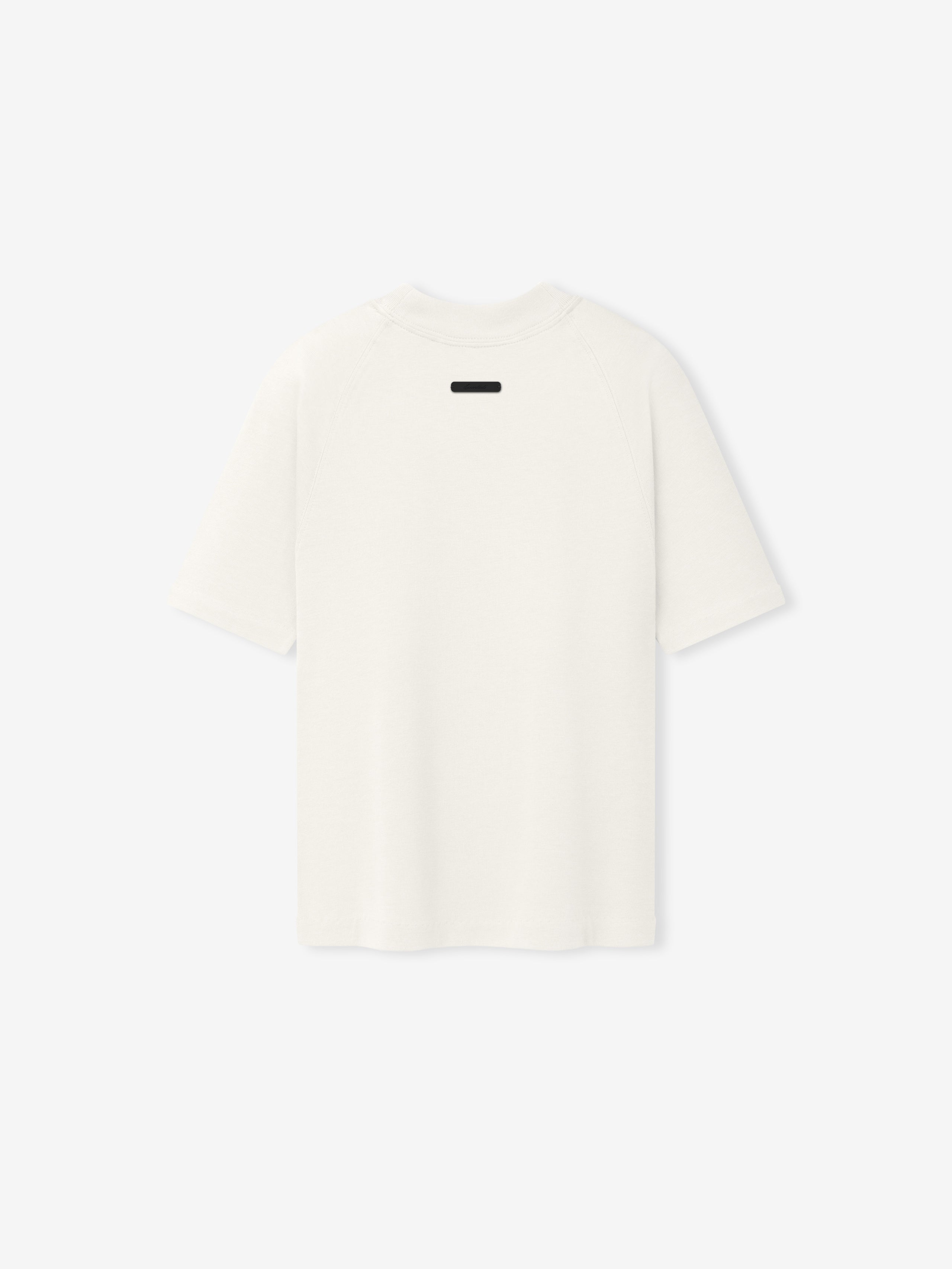 Womens Tri-Blend Shrunken Baseball Tee in a soft ivory hue showcasing a relaxed silhouette with short sleeves and a minimalist design, ideal as a casual top.