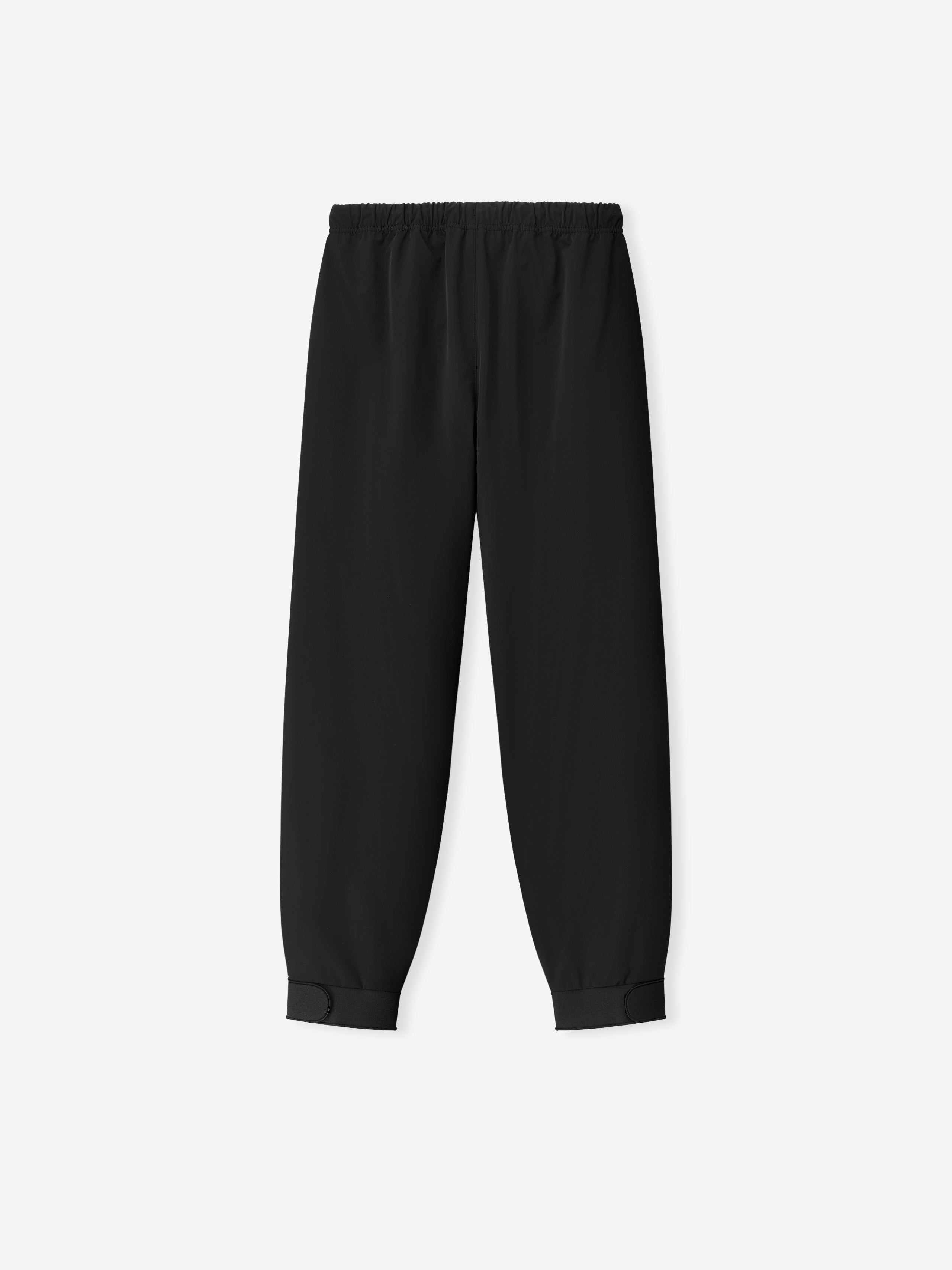 Womens Storm Pant in deep black featuring an elastic waistband and adjustable cuff closures at the ankles, crafted as versatile and comfortable bottoms.