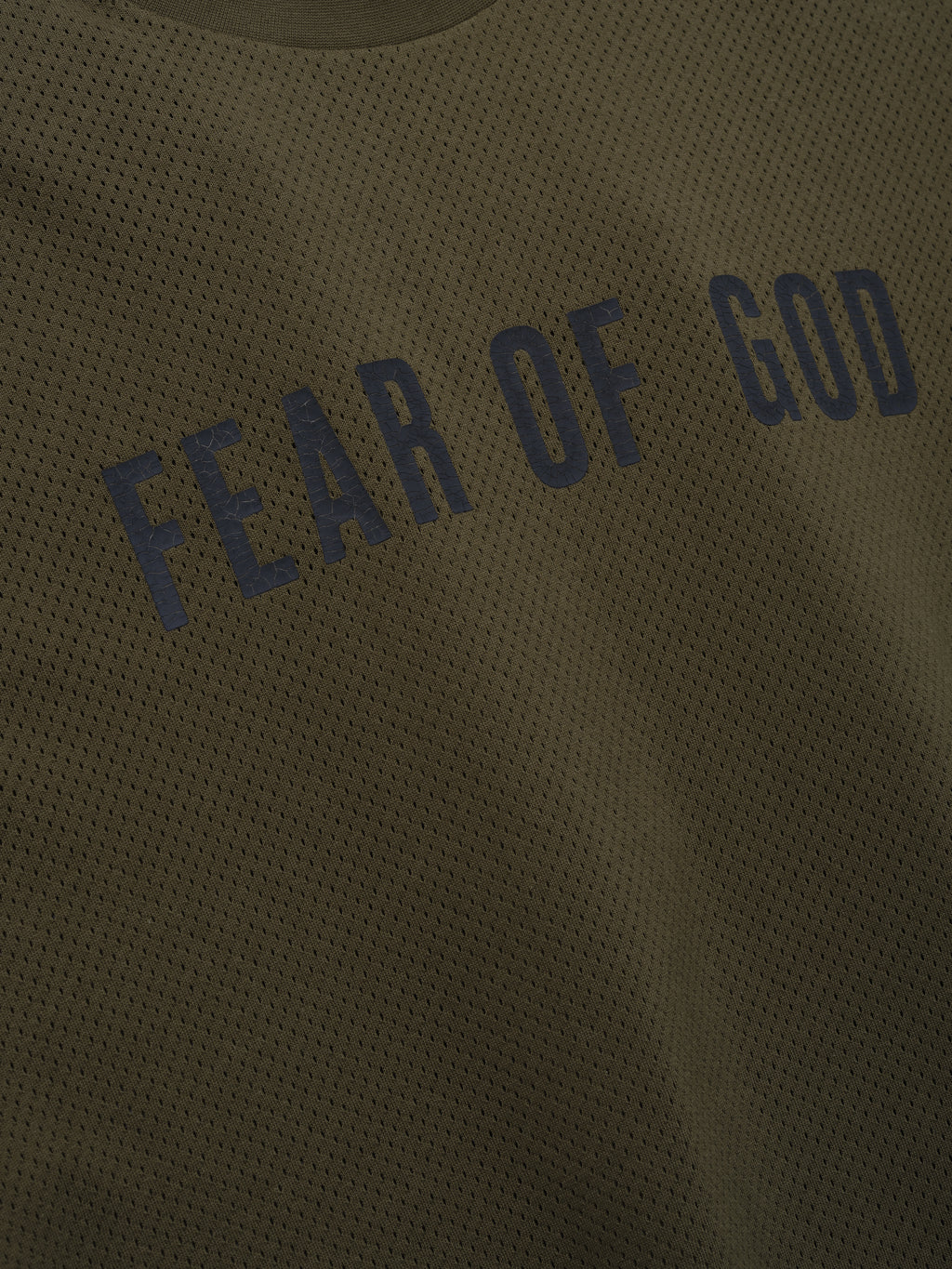 Sport Mesh Merch Long Sleeve Tee in olive mesh fabric featuring curved dark navy "Fear of God" text across the chest for a modern and breathable streetwear top.