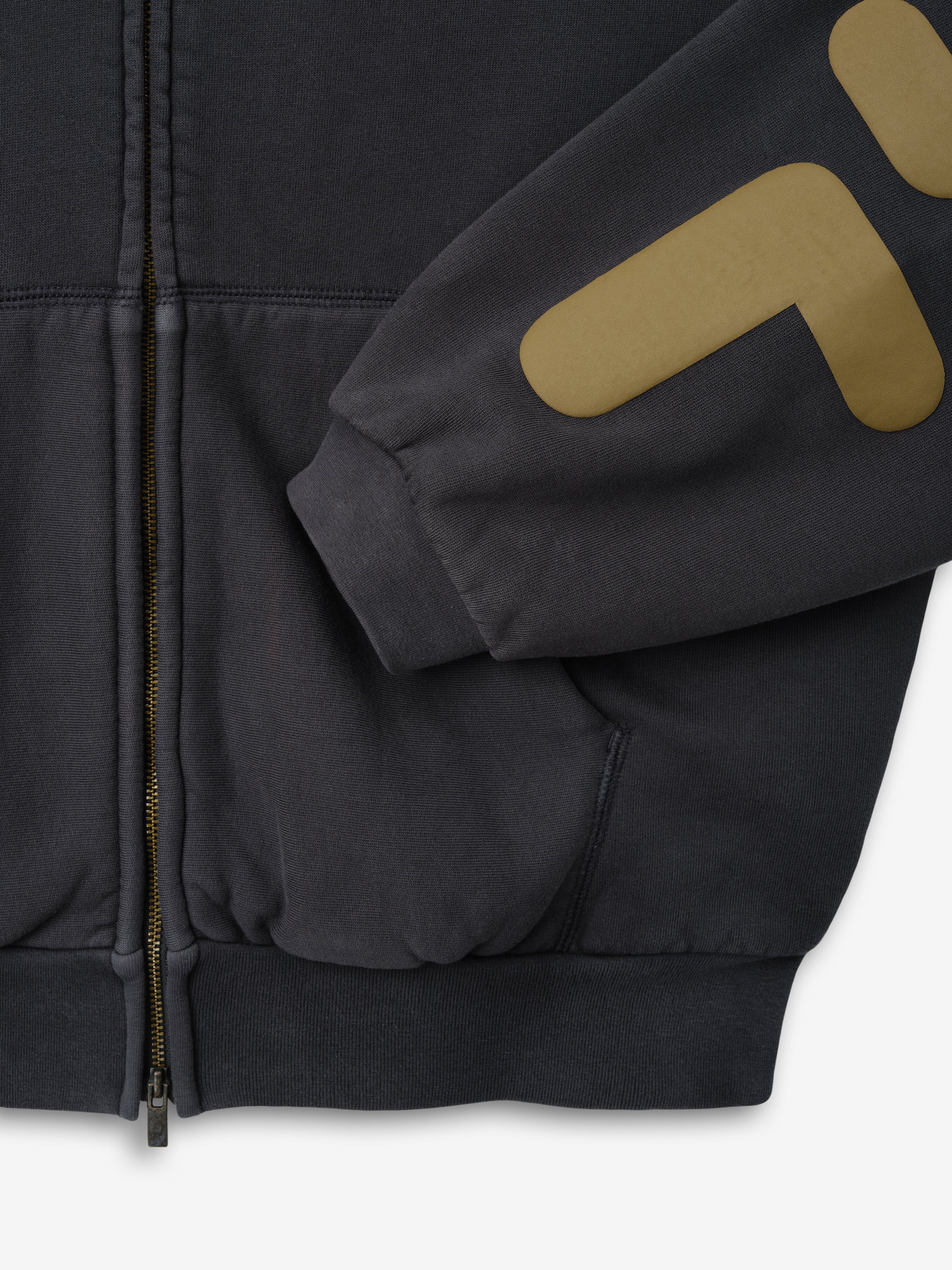 90'S Zip-Up Hoodie in a washed iron grey tone, featuring ribbed cuffs and hem, a full front zipper, front pouch pocket, and bold graphic print on the sleeve for standout outerwear.
