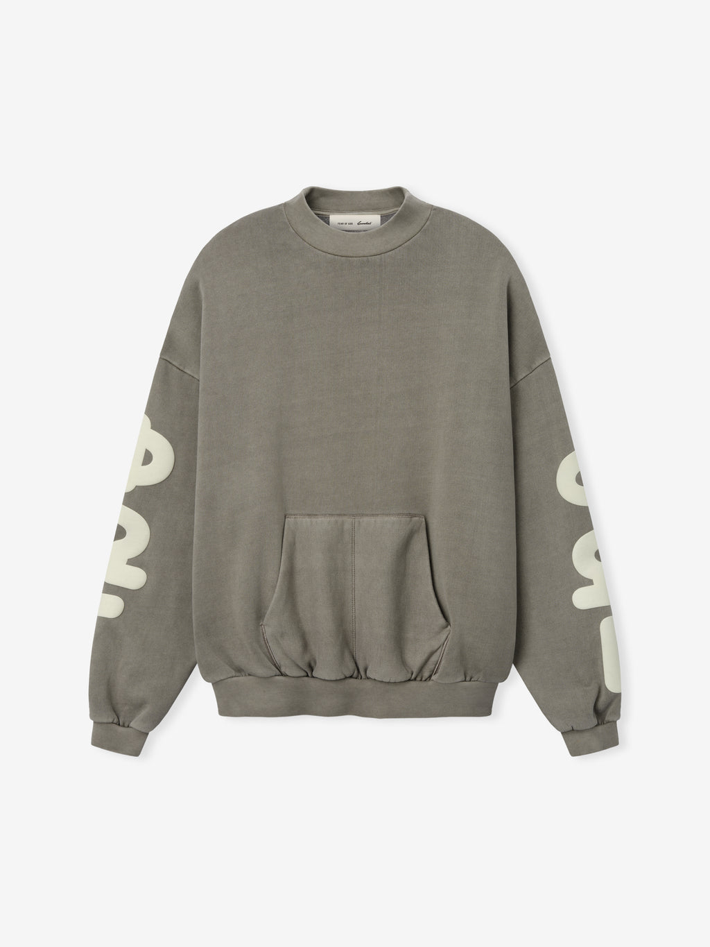 90'S Sweatshirt in a washed seal grey tone, featuring a relaxed fit with dropped shoulders, ribbed cuffs and hem, a front kangaroo pocket, and bold cream print on the sleeves.
