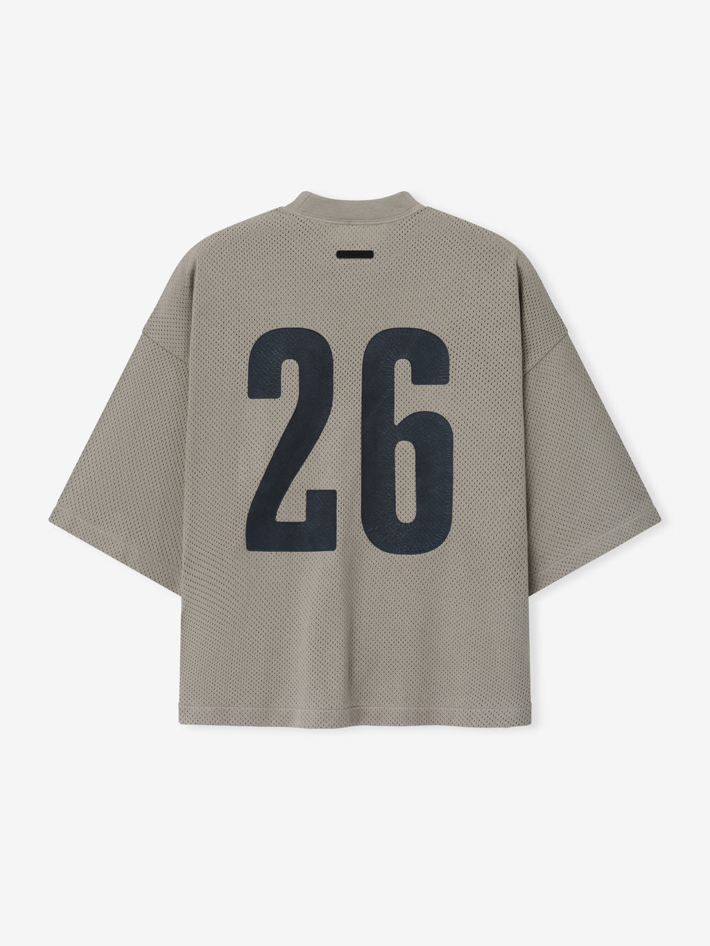Merch Tee in muted neutral tone featuring a textured fabric with an oversized fit and large bold black number "26" printed on the back for a modern casual top.