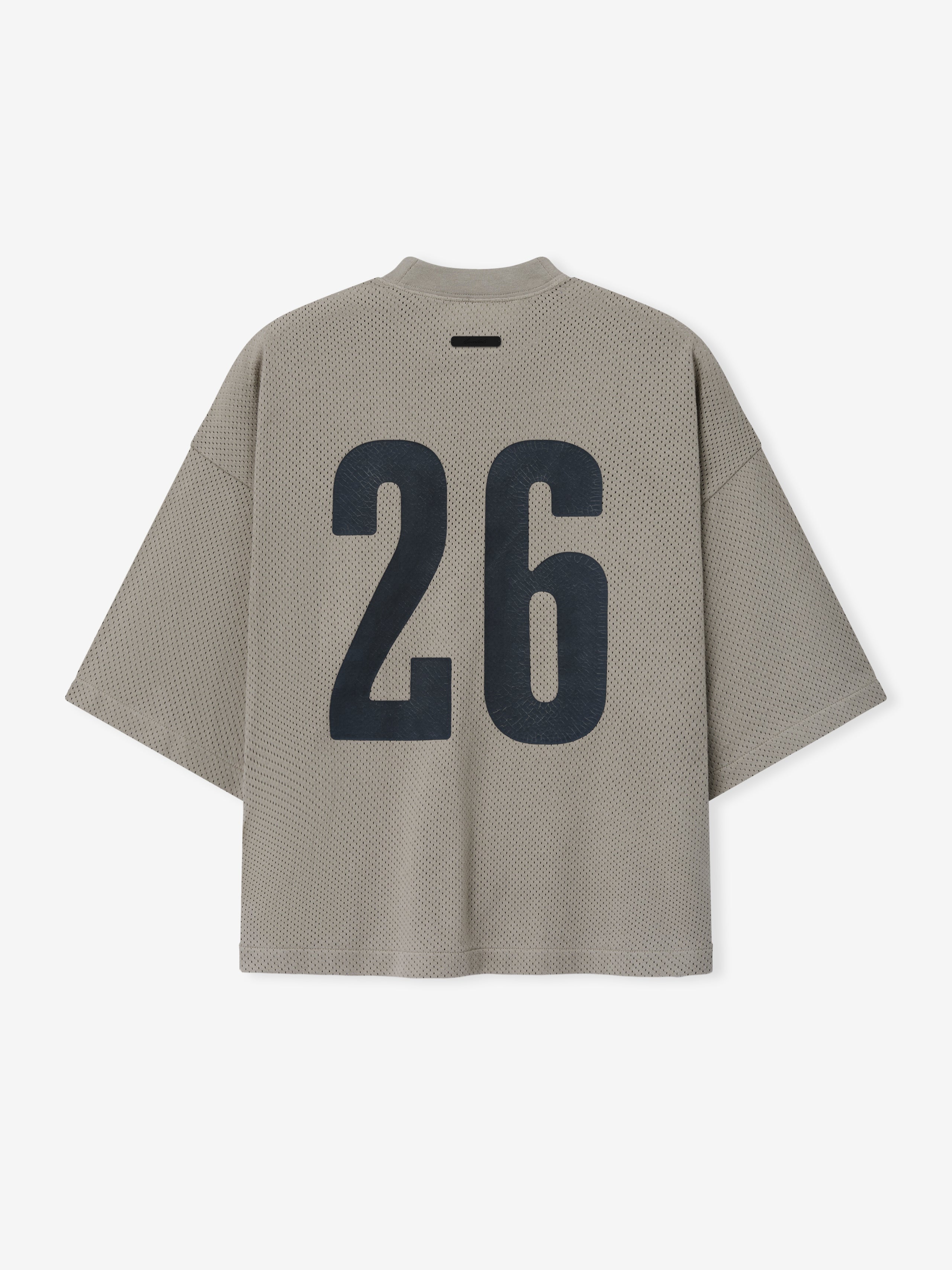 Merch Tee in muted neutral tone featuring a textured fabric with an oversized fit and large bold black number "26" printed on the back for a modern casual top.