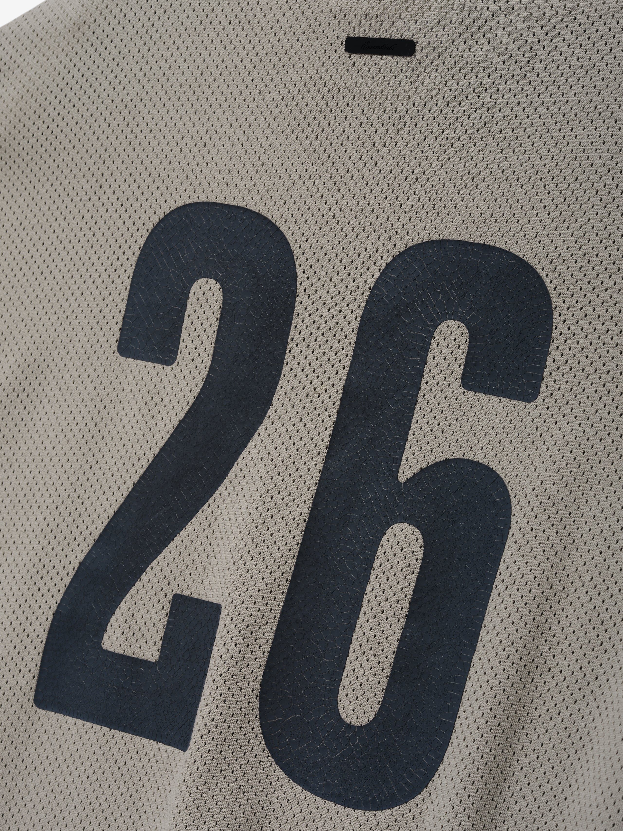 Merch Tee in light seal tone featuring breathable mesh fabric with large textured black number "26" printed on the back for a sporty, casual top.