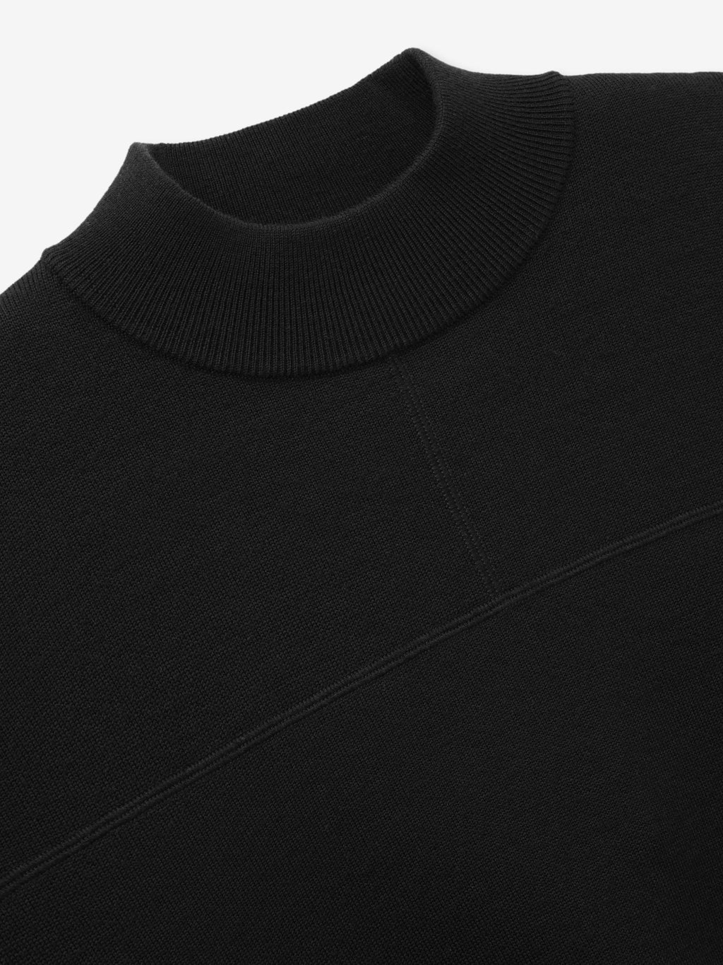 Merino Double Knit Mockneck Sweater in black shown close up with a ribbed mockneck collar and tonal diagonal seam detail as Tops