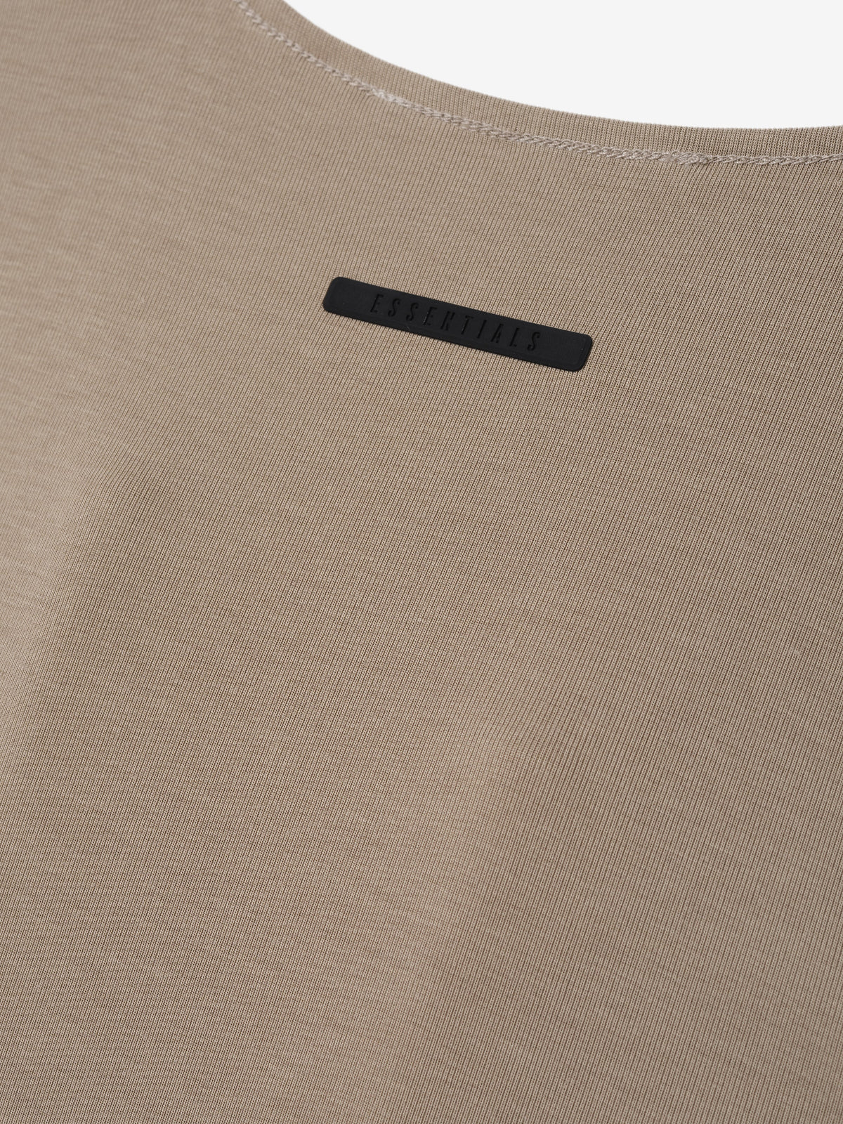 Womens V-Neck Tank in taupe shown close up with fine ribbed fabric a curved neckline and subtle black chest label as Tops