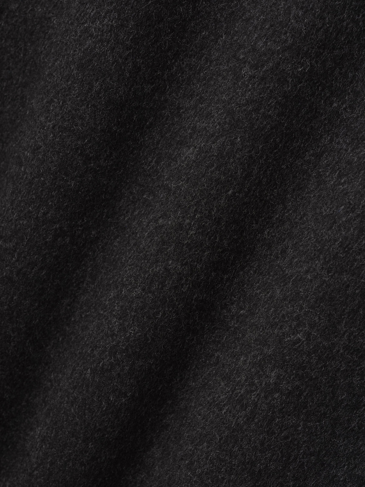 Double Face Wool Cashmere Overcoat in black shown in close detail highlighting the soft brushed wool cashmere texture as Outerwear