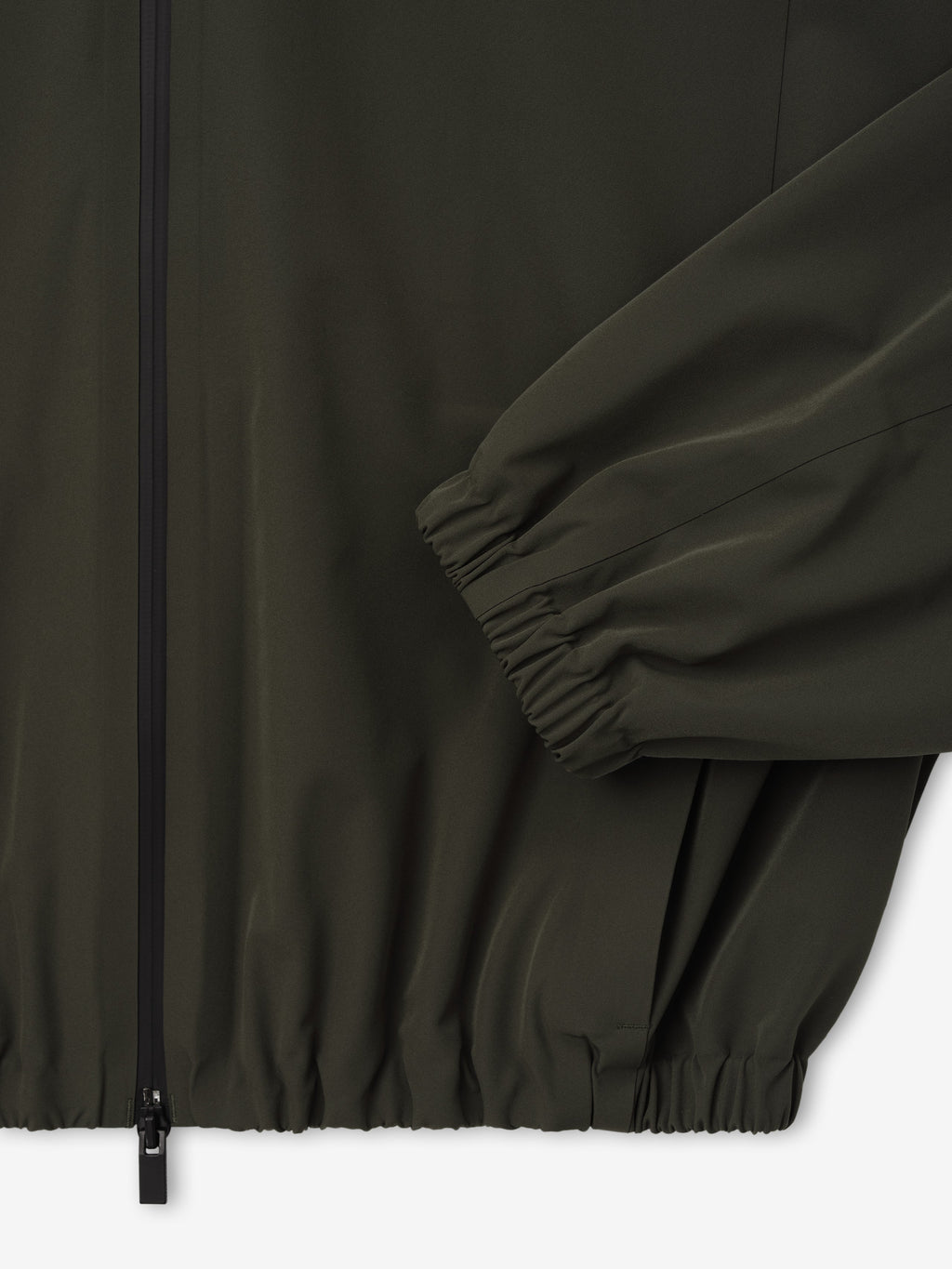 Bonded Nylon Track Jacket in dark olive shown close up with a front zip closure gathered sleeve cuff elastic hem and side pocket as Outerwear