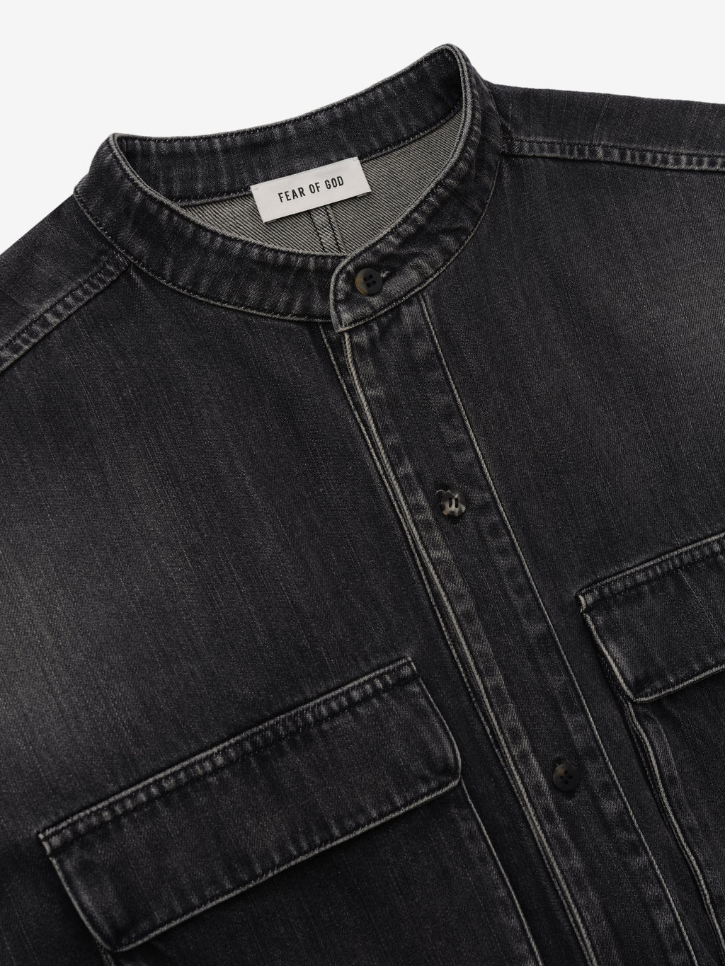 Denim Military Shirt in dark gray denim shown in close detail with a stand collar button front flap chest pockets and Fear of God label as Tops