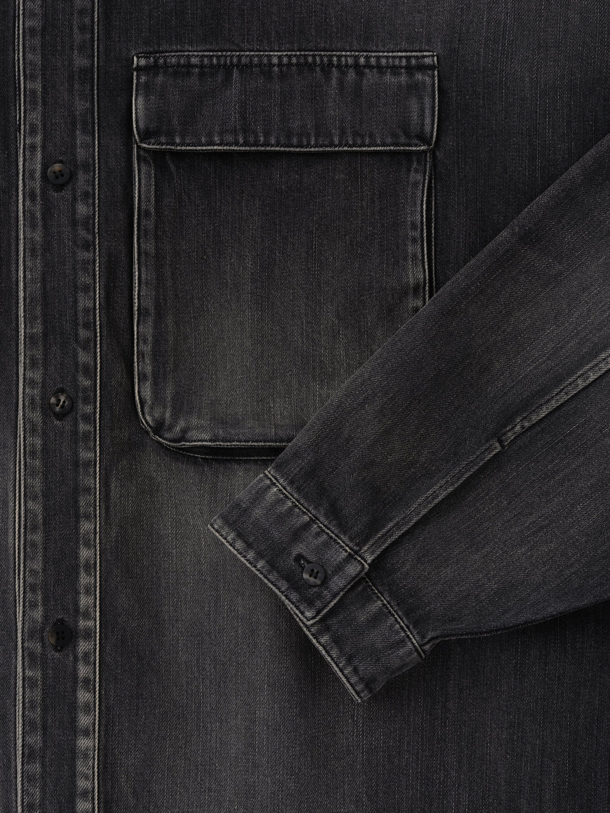Denim Military Shirt in dark gray denim shown in close detail with a flap chest pocket button front sleeve cuff and tonal stitching as Tops