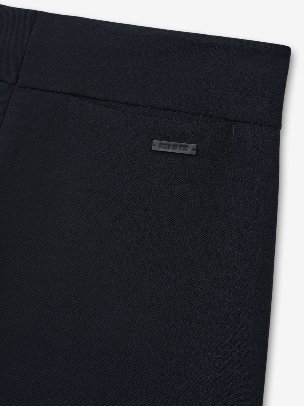 Double Weave Cotton Wool Casual Flat Front Trousers shown close up in dark navy with a flat waistband and subtle Fear of God label as Bottoms