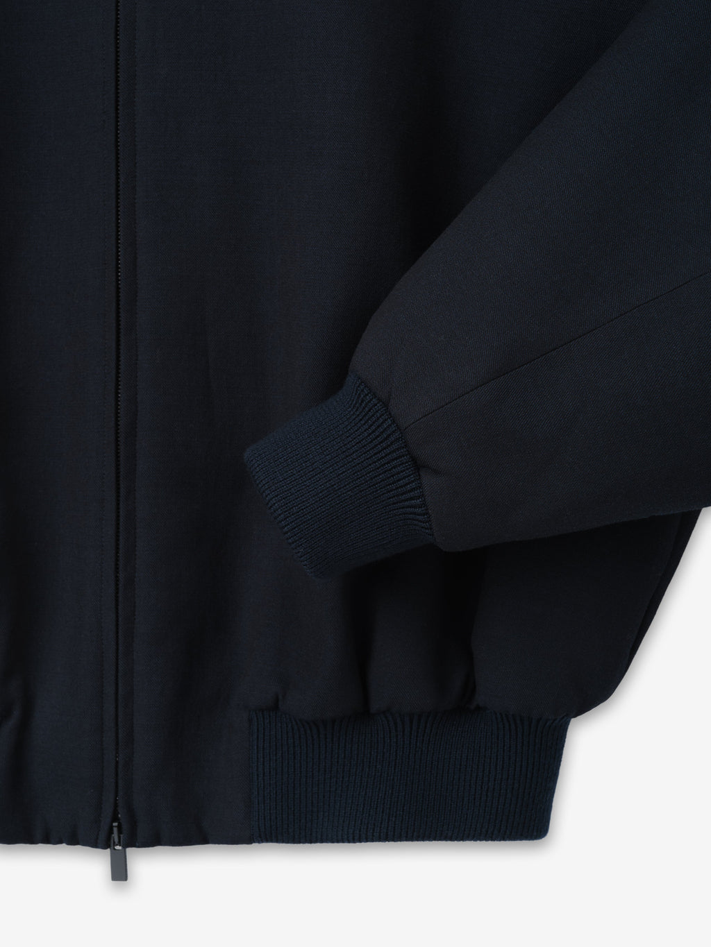 Double Weave Cotton Wool Eternal Bomber shown close up in dark navy with ribbed sleeve cuff hem and concealed zip front as Outerwear