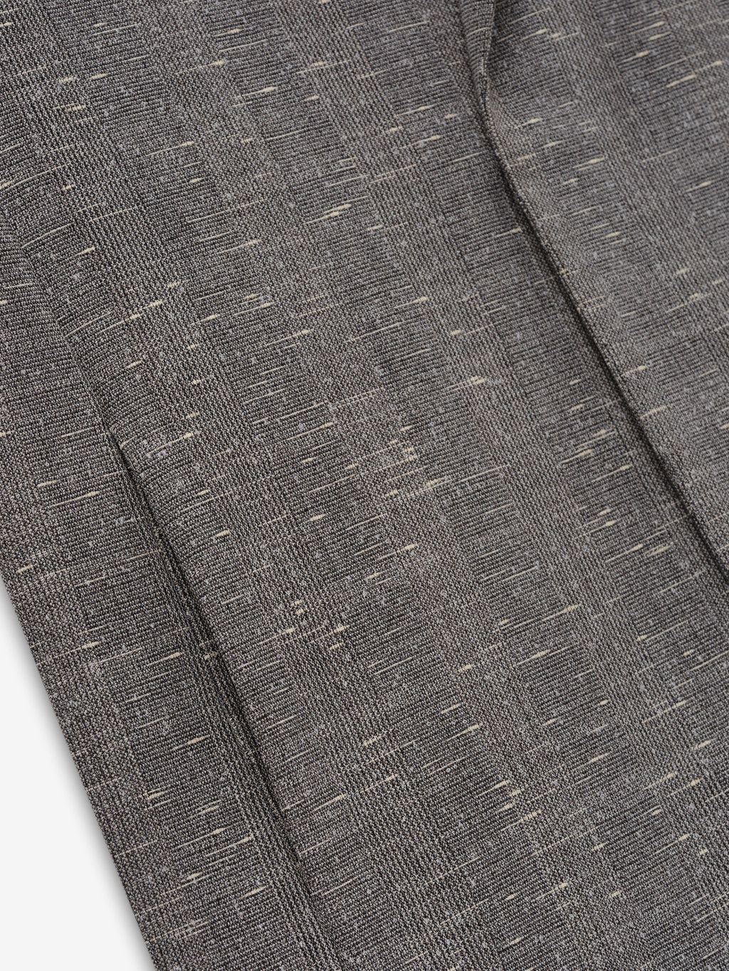 Slub Wool Cotton Belted Jacket close up showing textured gray slub weave with flecked fibers and a tailored seam detail as Outerwear