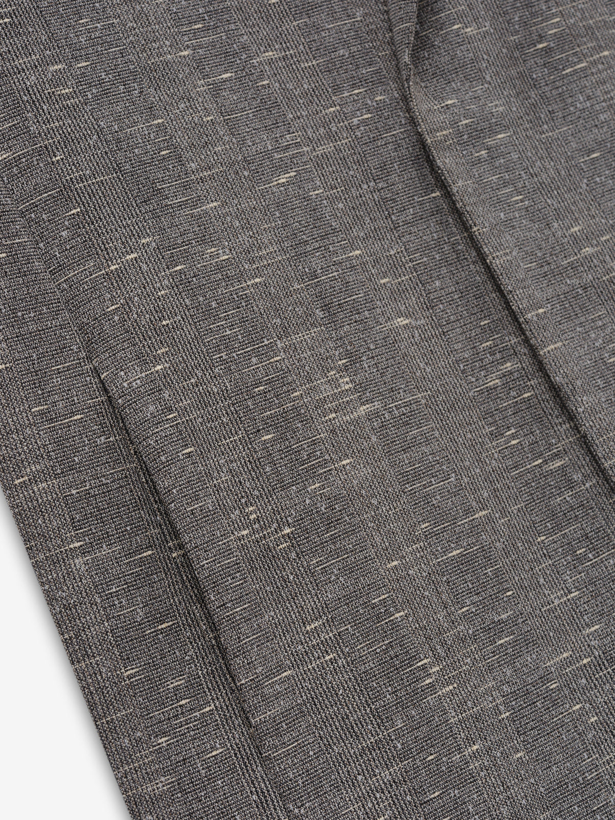 Slub Wool Cotton Belted Jacket close up showing textured gray slub weave with flecked fibers and a tailored seam detail as Outerwear