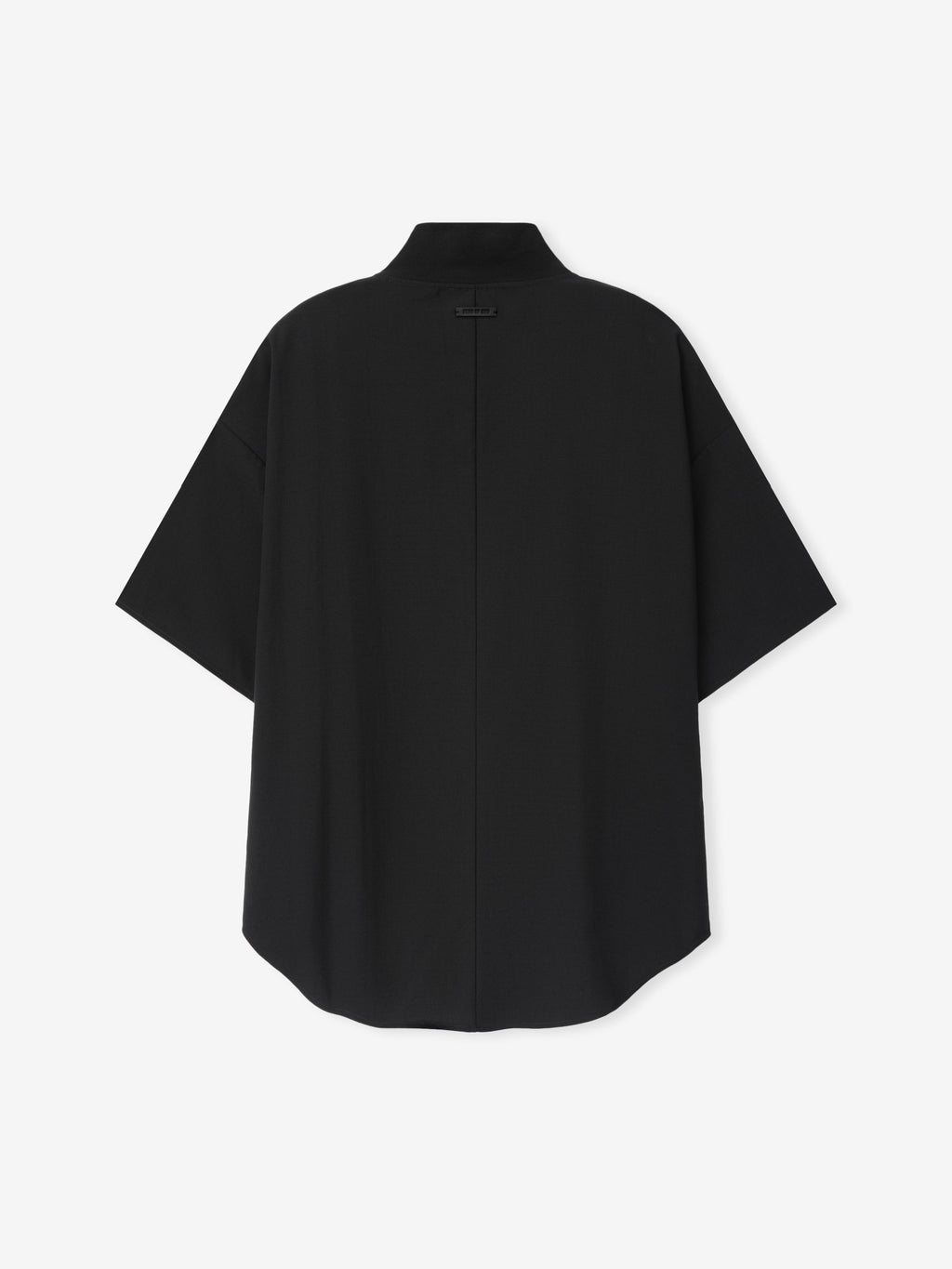 Wool Ripstop Pullover Shirt shown flat in black with a stand collar short sleeves central closure relaxed shape and curved hem as Tops