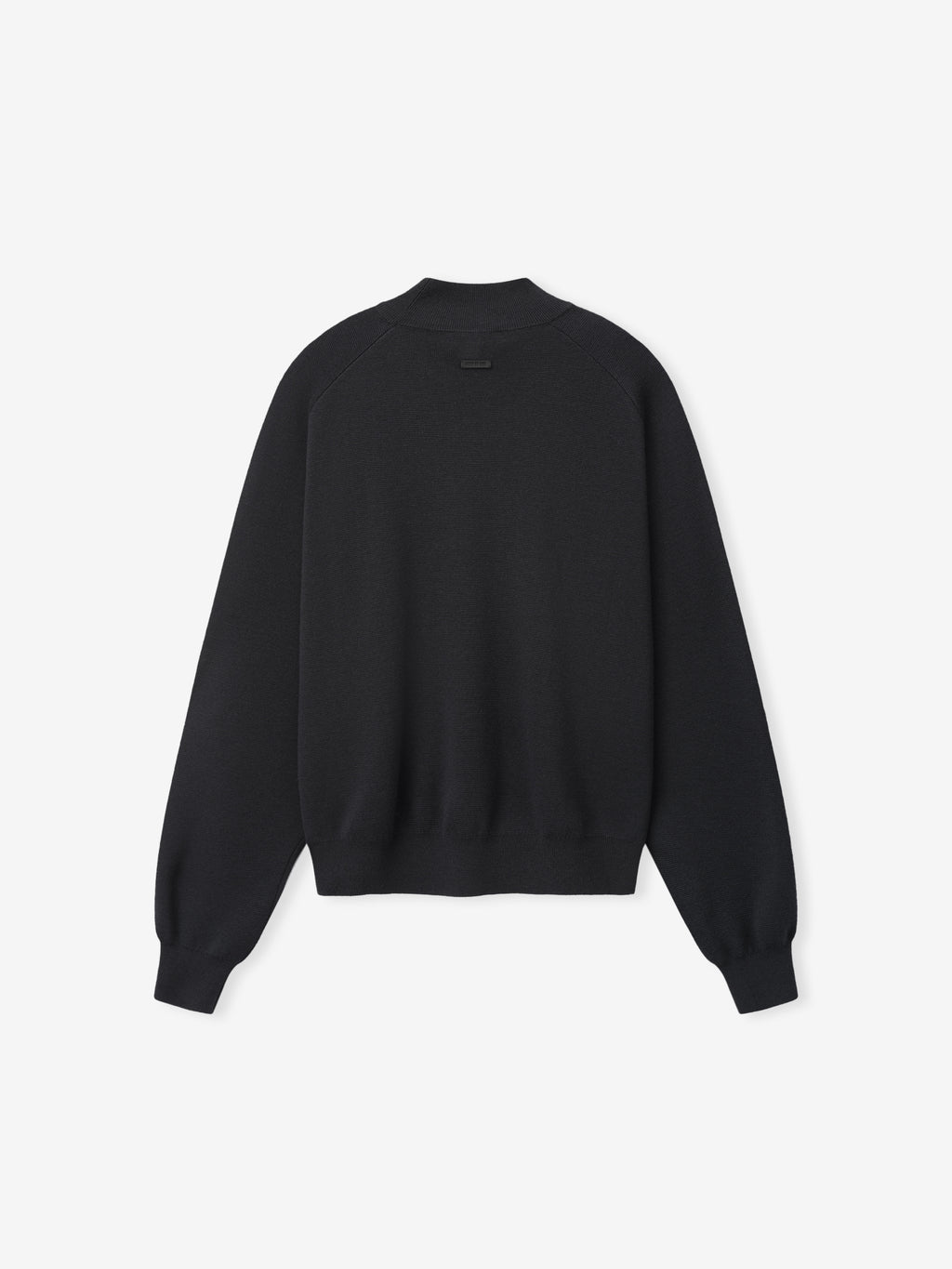 Merino Knit Mockneck Sweater laid flat in black with a high ribbed neckline dropped shoulders long sleeves ribbed cuffs and a straight hem as Tops