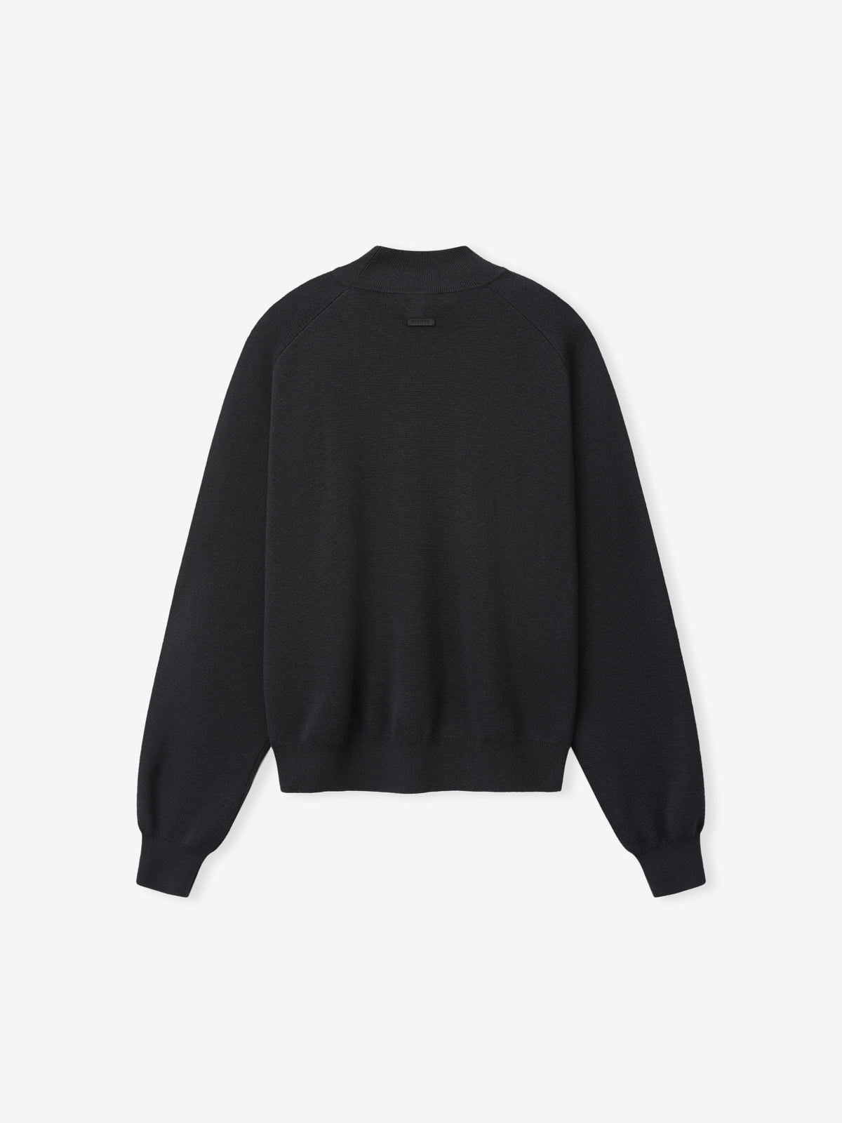 Merino Knit Mockneck Sweater laid flat in black with a high ribbed neckline dropped shoulders long sleeves ribbed cuffs and a straight hem as Tops