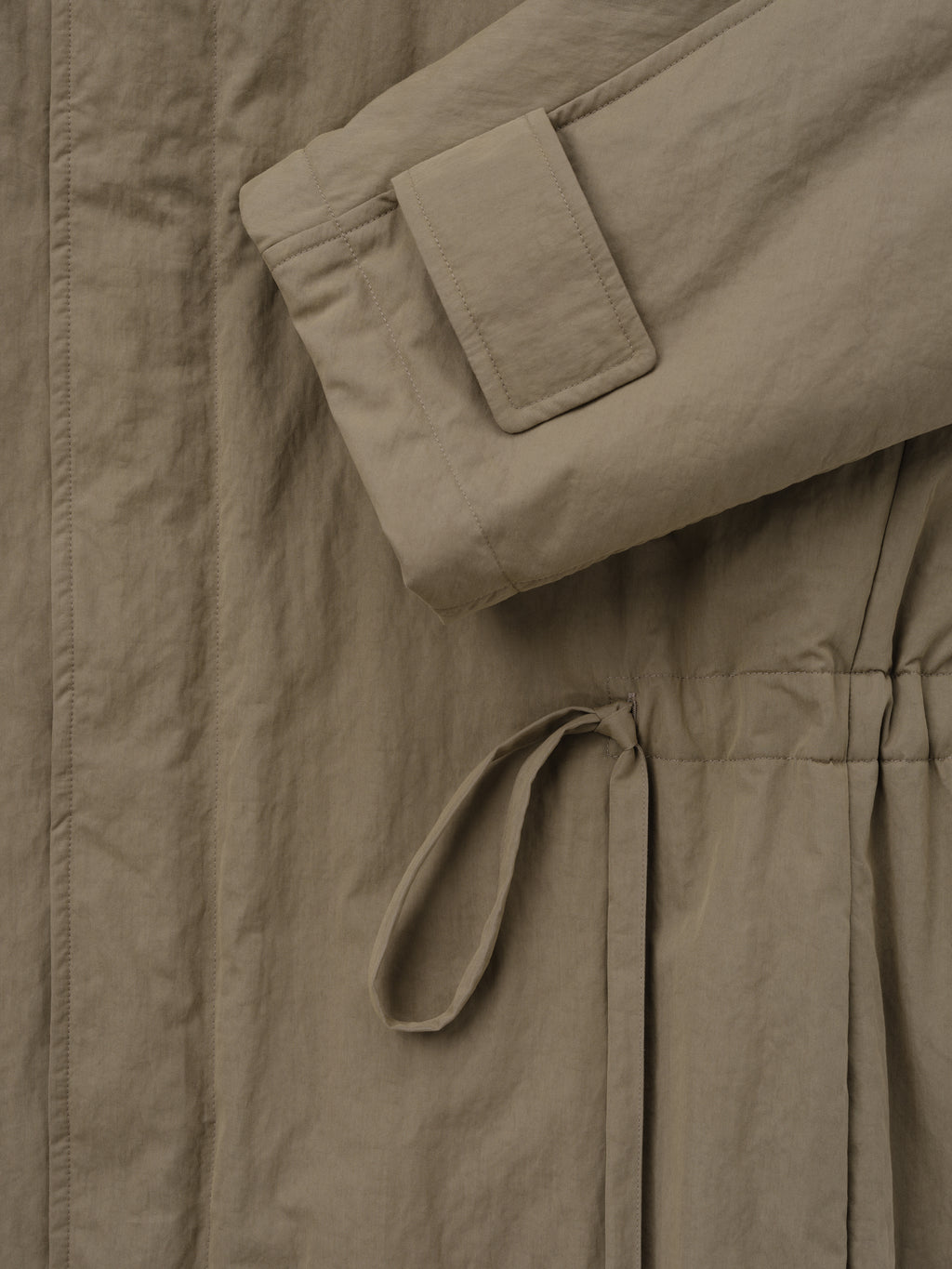 Washed Cotton Nylon Gabardine Field Jacket close up in taupe showing a flap pocket drawcord waist and textured fabric as Outerwear