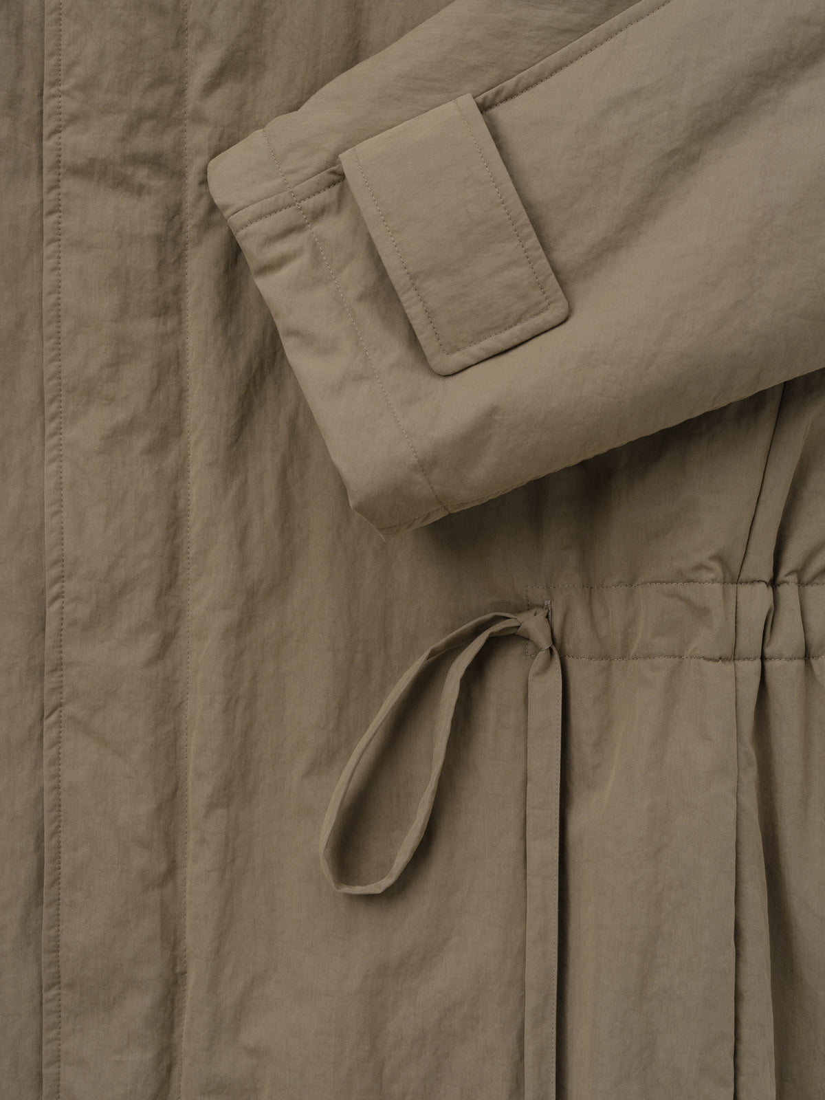 Washed Cotton Nylon Gabardine Field Jacket close up in taupe showing a flap pocket drawcord waist and textured fabric as Outerwear