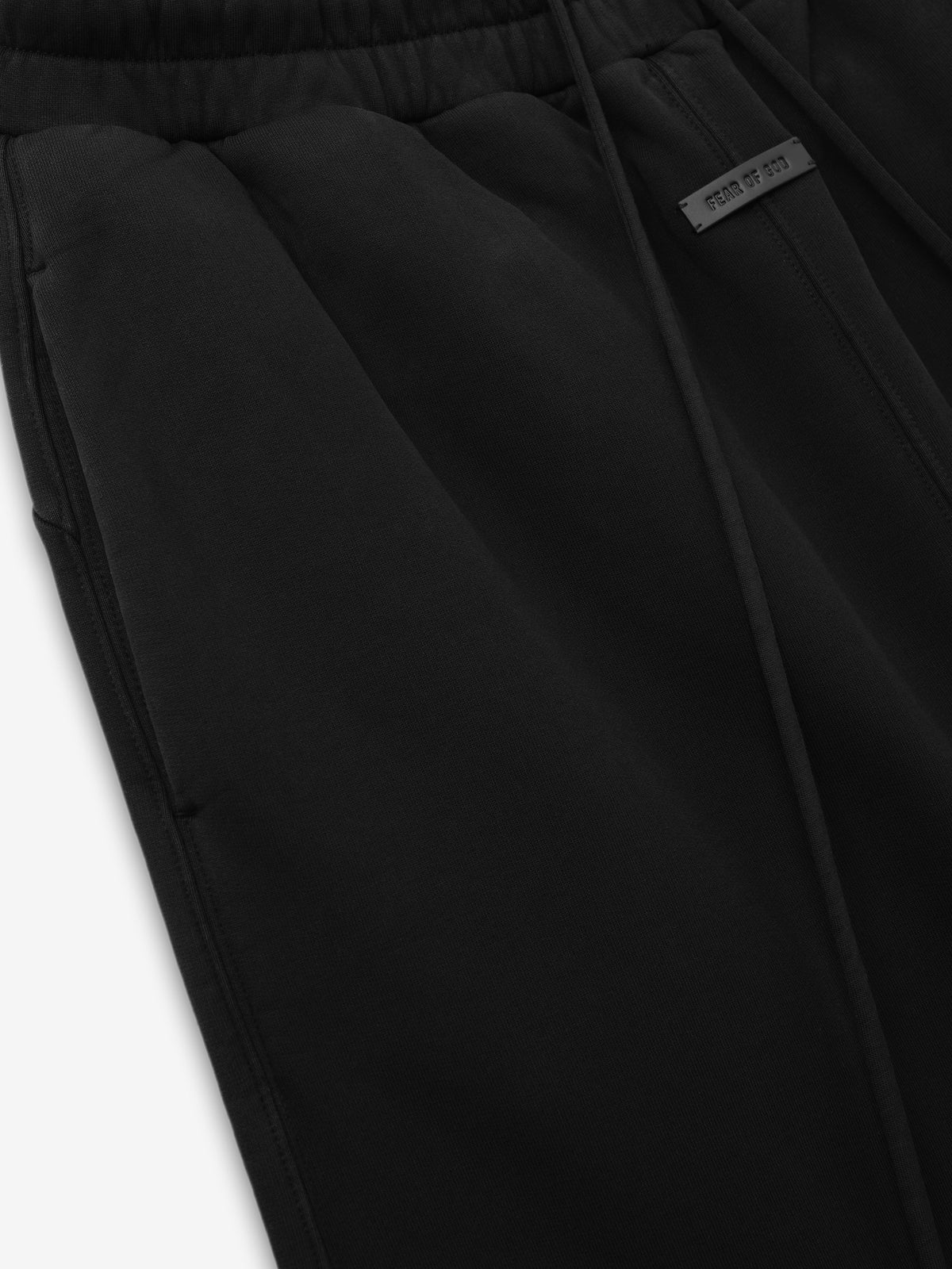 Wide Leg Sweatpants close up in black showing the elastic drawstring waistband side pocket seam and small woven label as Bottoms