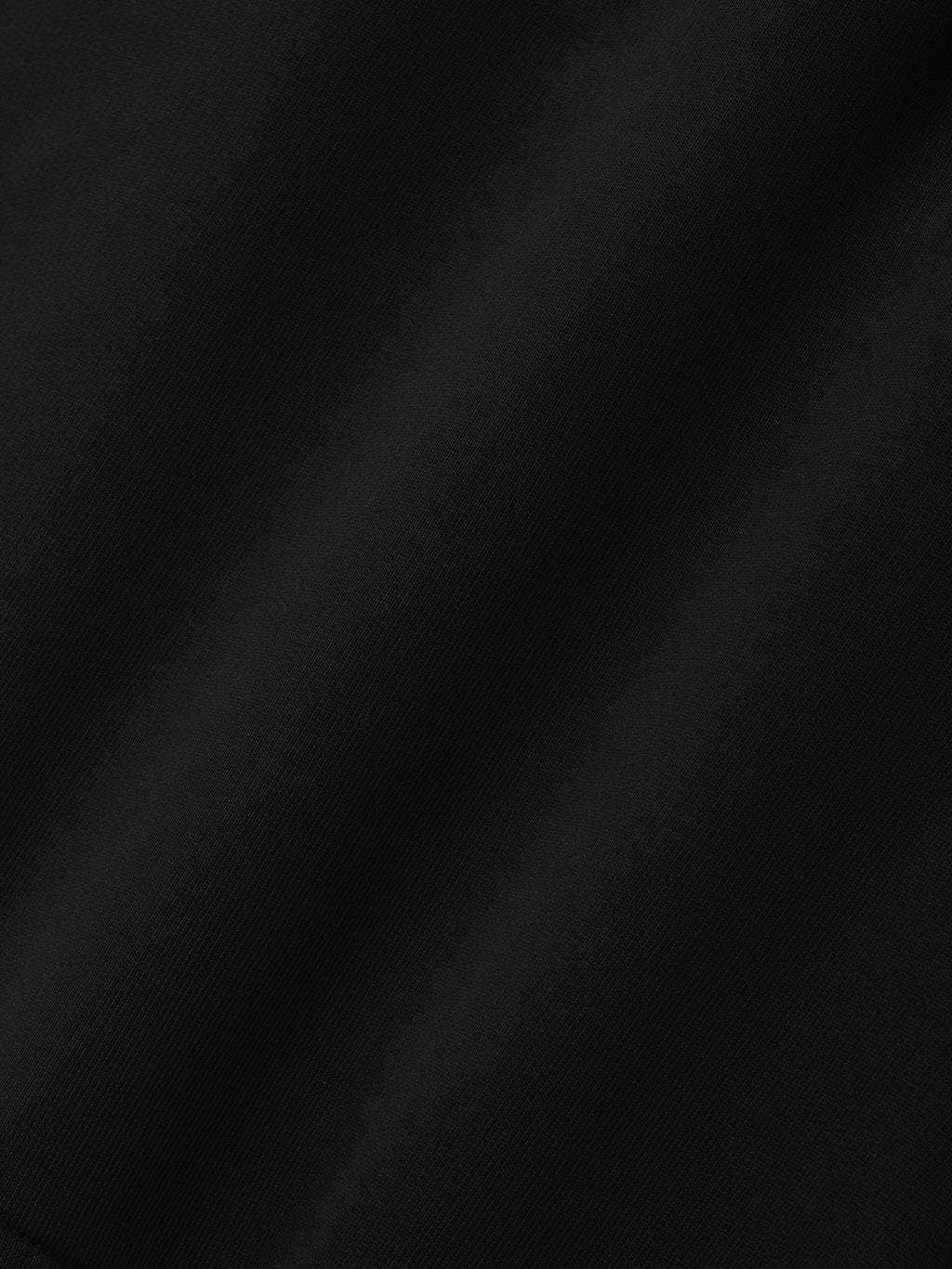 Fleece Basketball Shorts in black shown close up with soft fleece texture and subtle tonal fabric variation as Bottoms