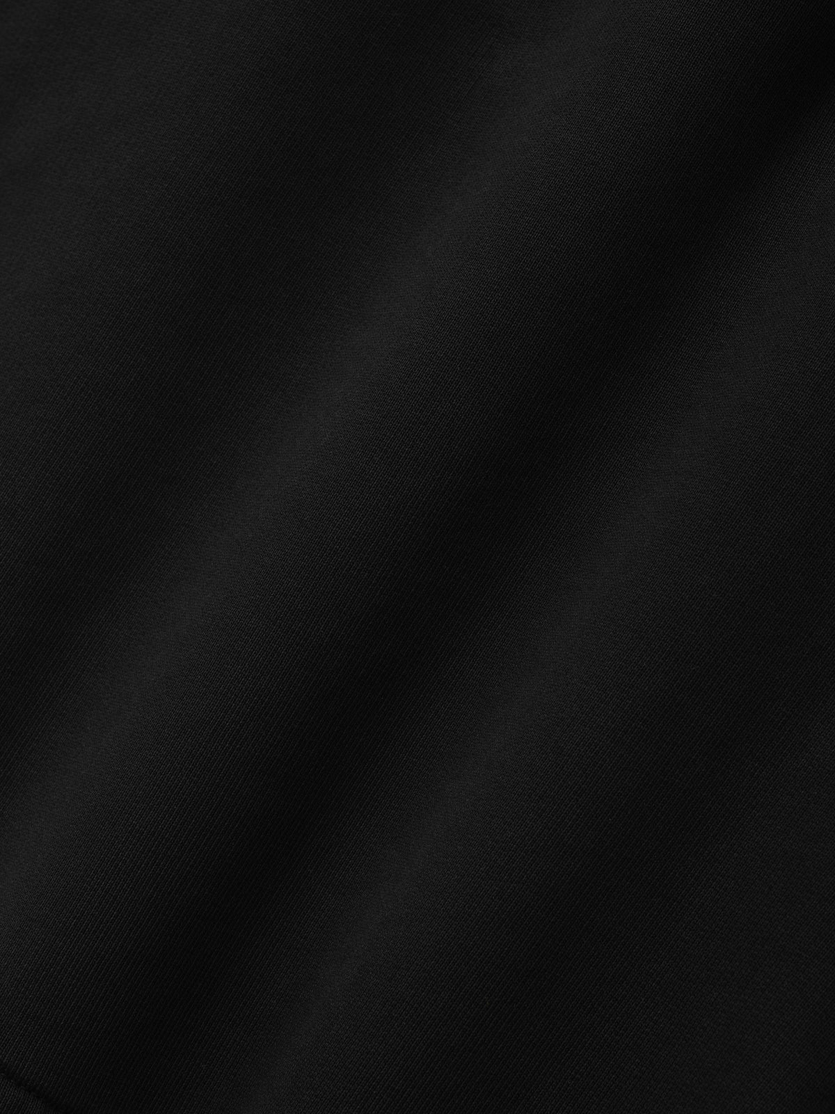 Fleece Basketball Shorts in black shown close up with soft fleece texture and subtle tonal fabric variation as Bottoms