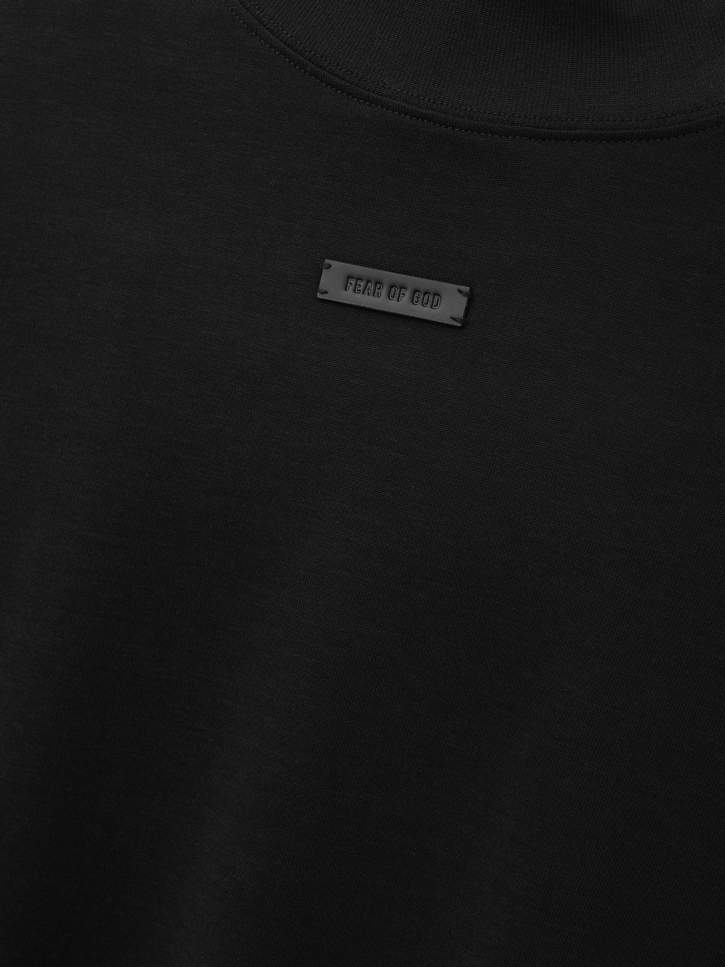 Cotton Rayon Mockneck Short Sleeve Tee in black shown in close detail with mockneck collar and Fear of God label as Tops