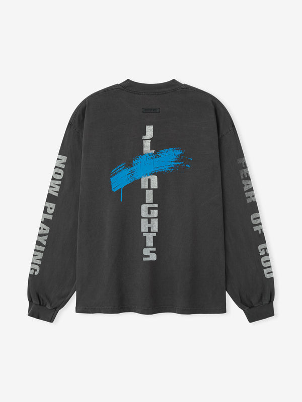 Black long-sleeve shirt with blue and white text on a white background